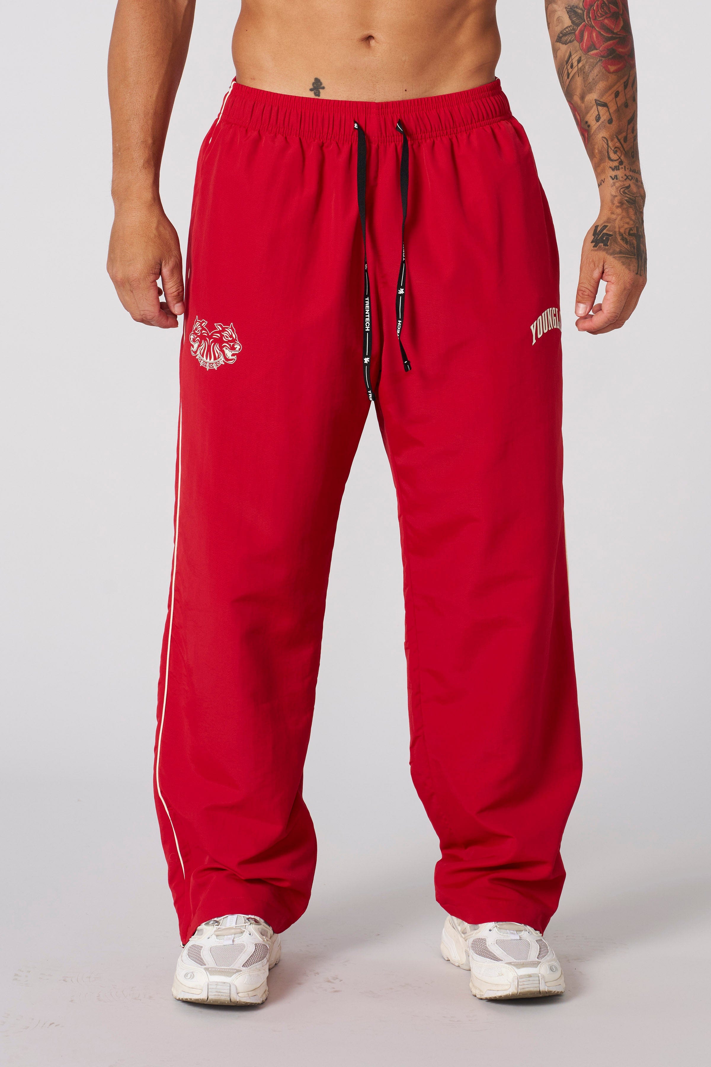 Relaxed fit of Tren Twins mens sweatpants displayed outdoors.