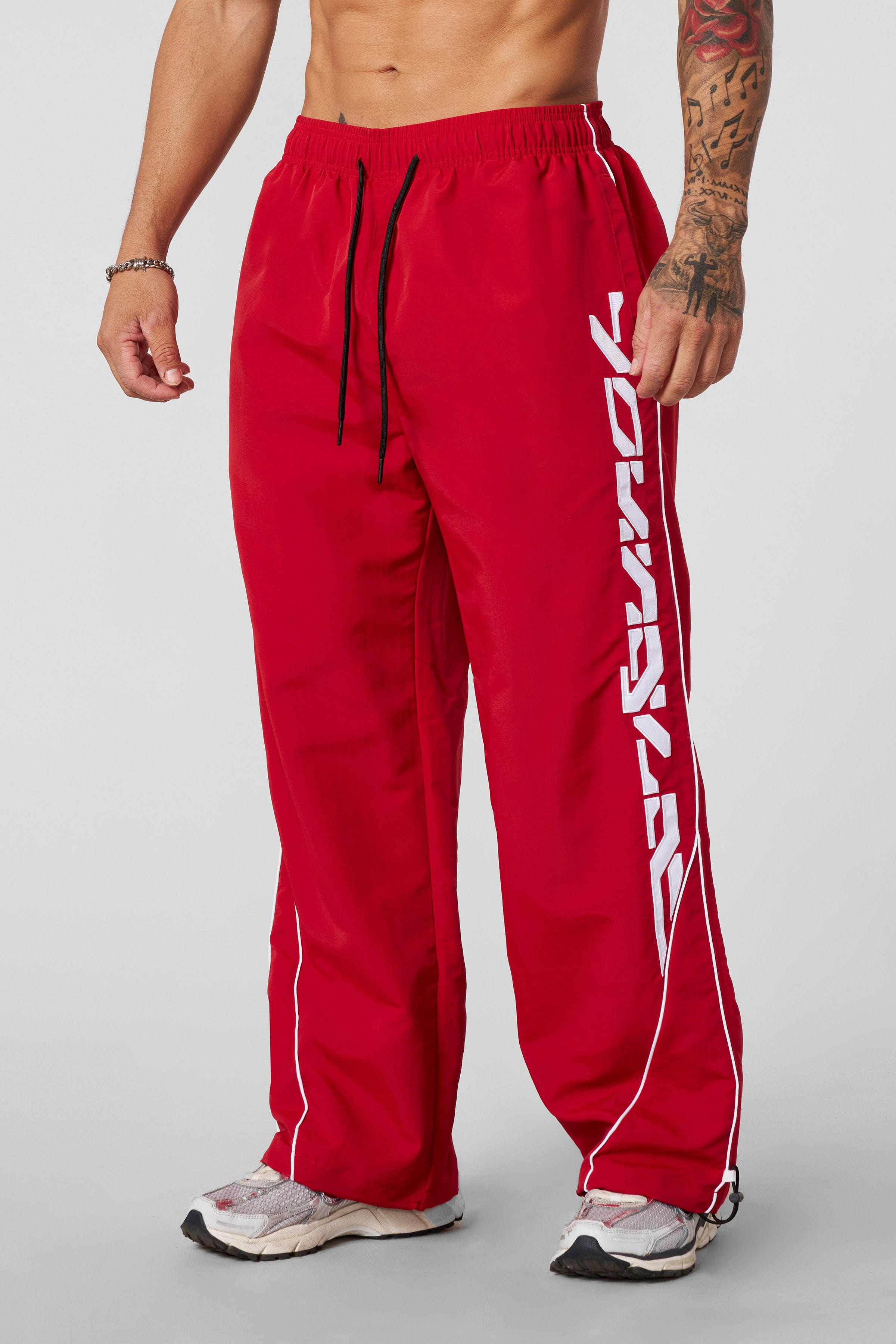 Model wearing Foundation Performance Track Pants during a workout session.