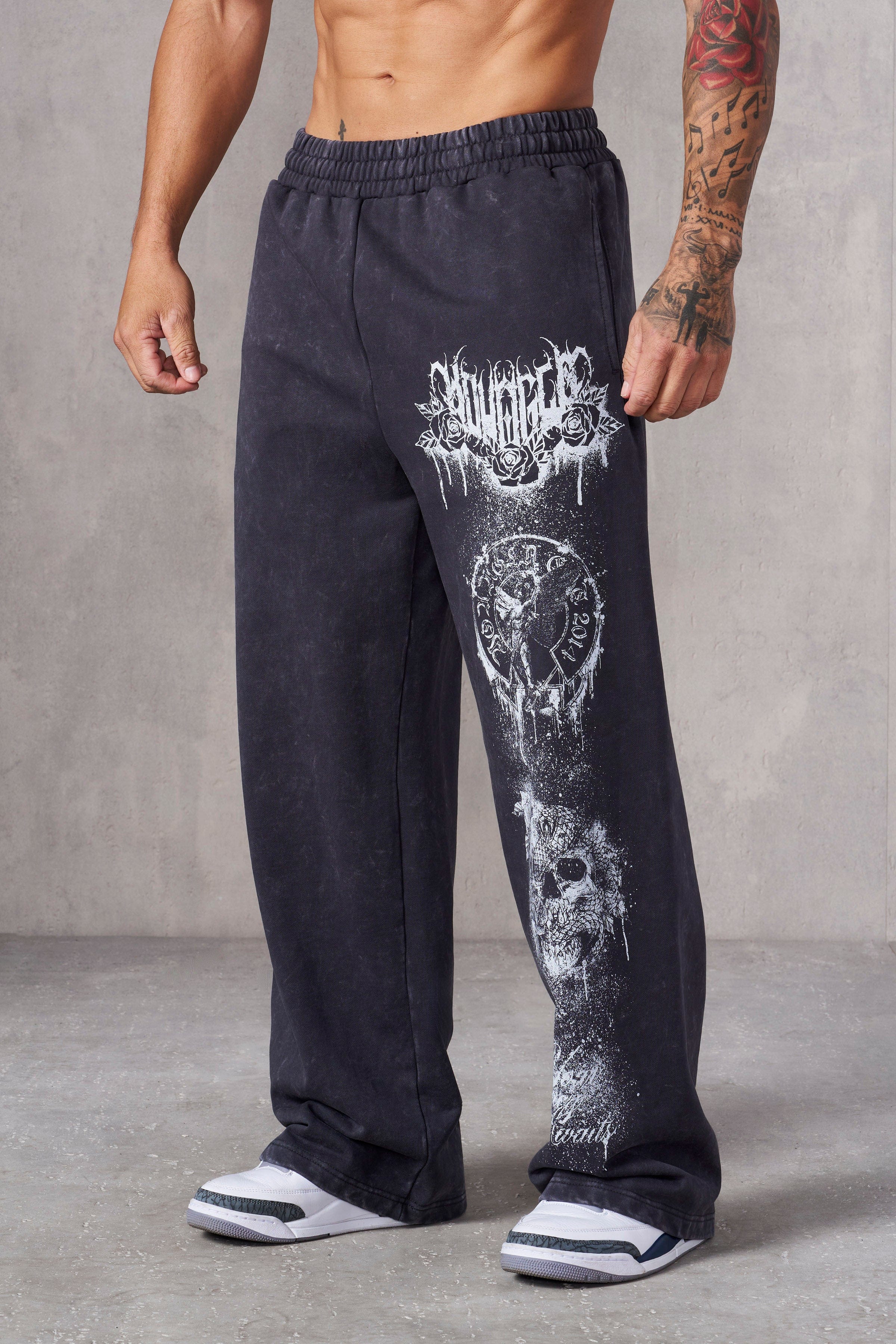 Front view of a model in Dynasty baggy joggers with splatter print.