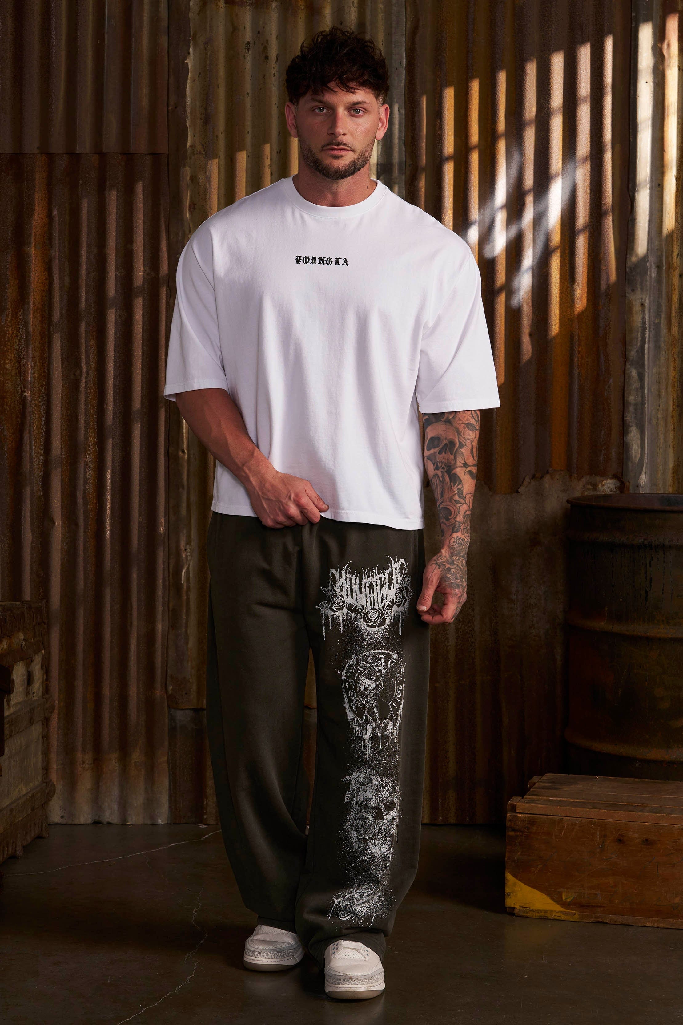 Side view of a model wearing Dynasty joggers, highlighting the baggy fit.