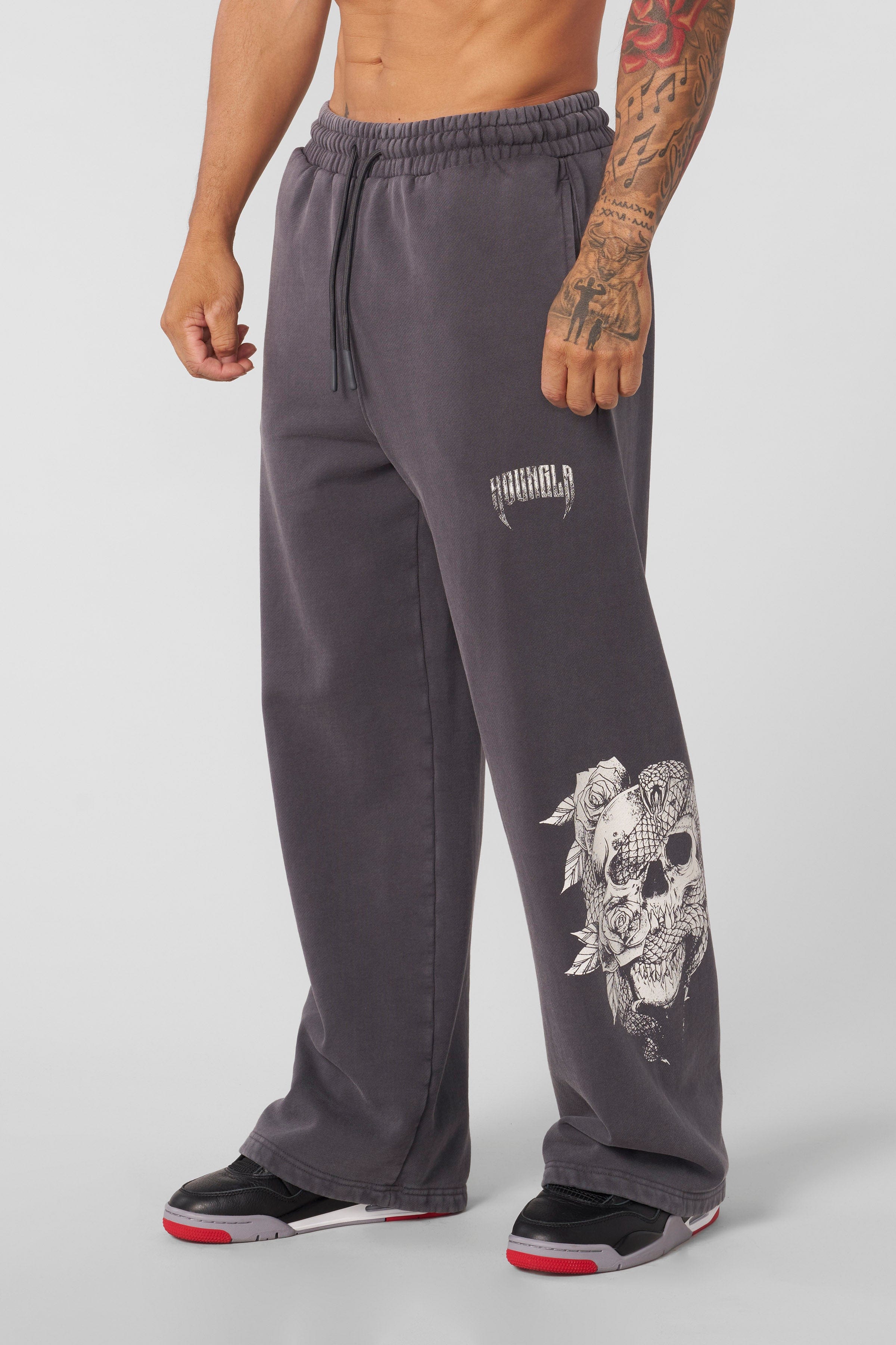 Close-up of the elastic waistband on the graphic sweatpants.