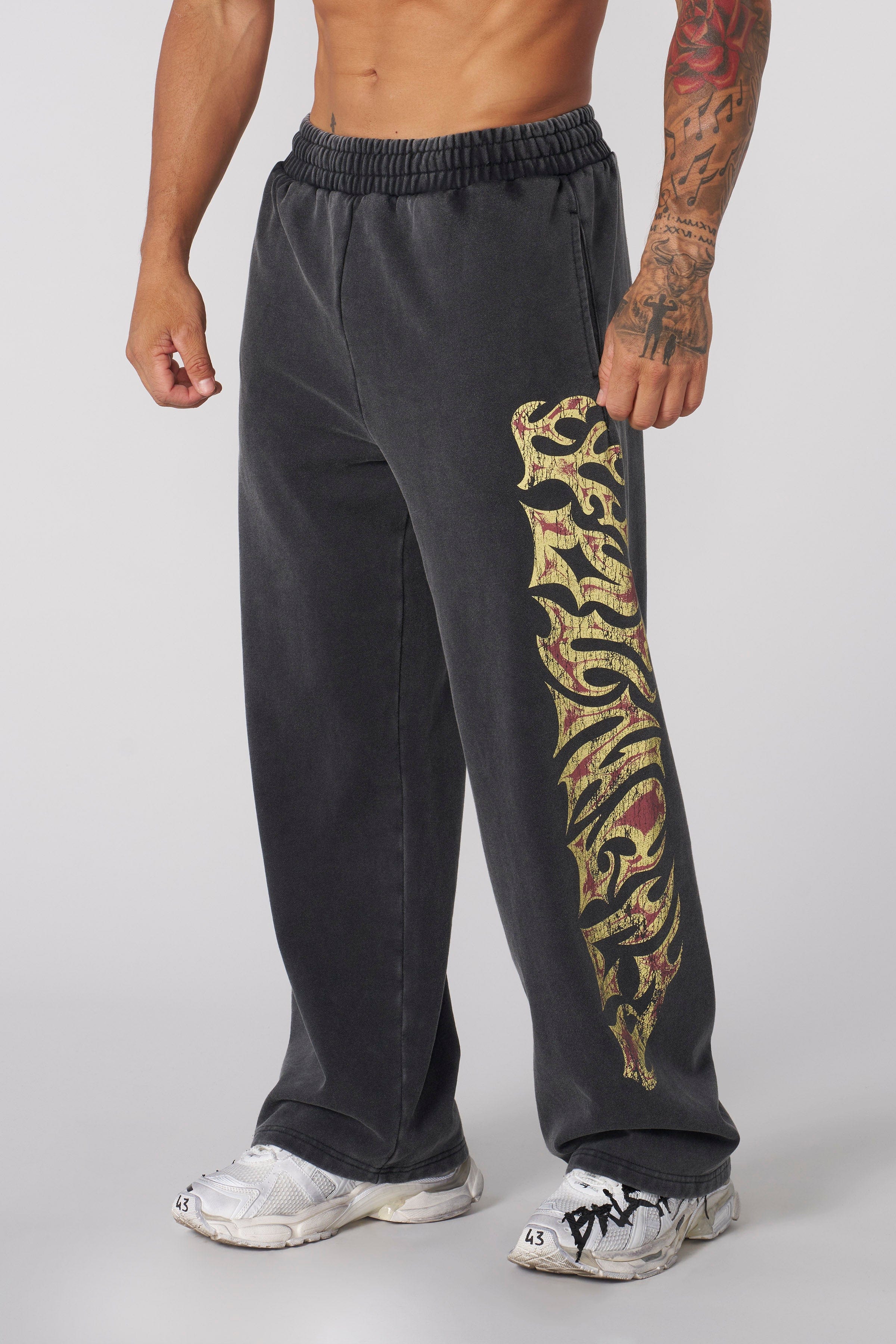 Inferno baggy sweats showcasing fire logo design from the side.