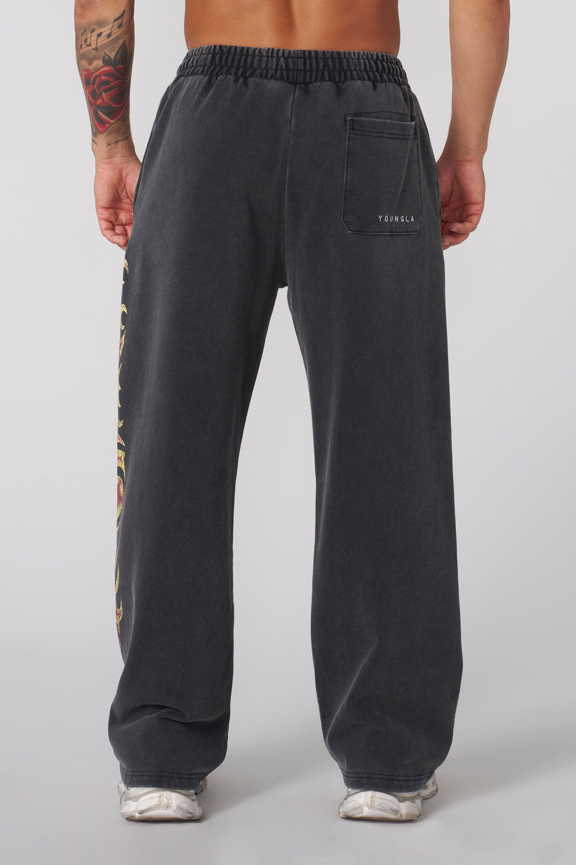 Model wearing Inferno baggy sweats styled with a cotton sweater.