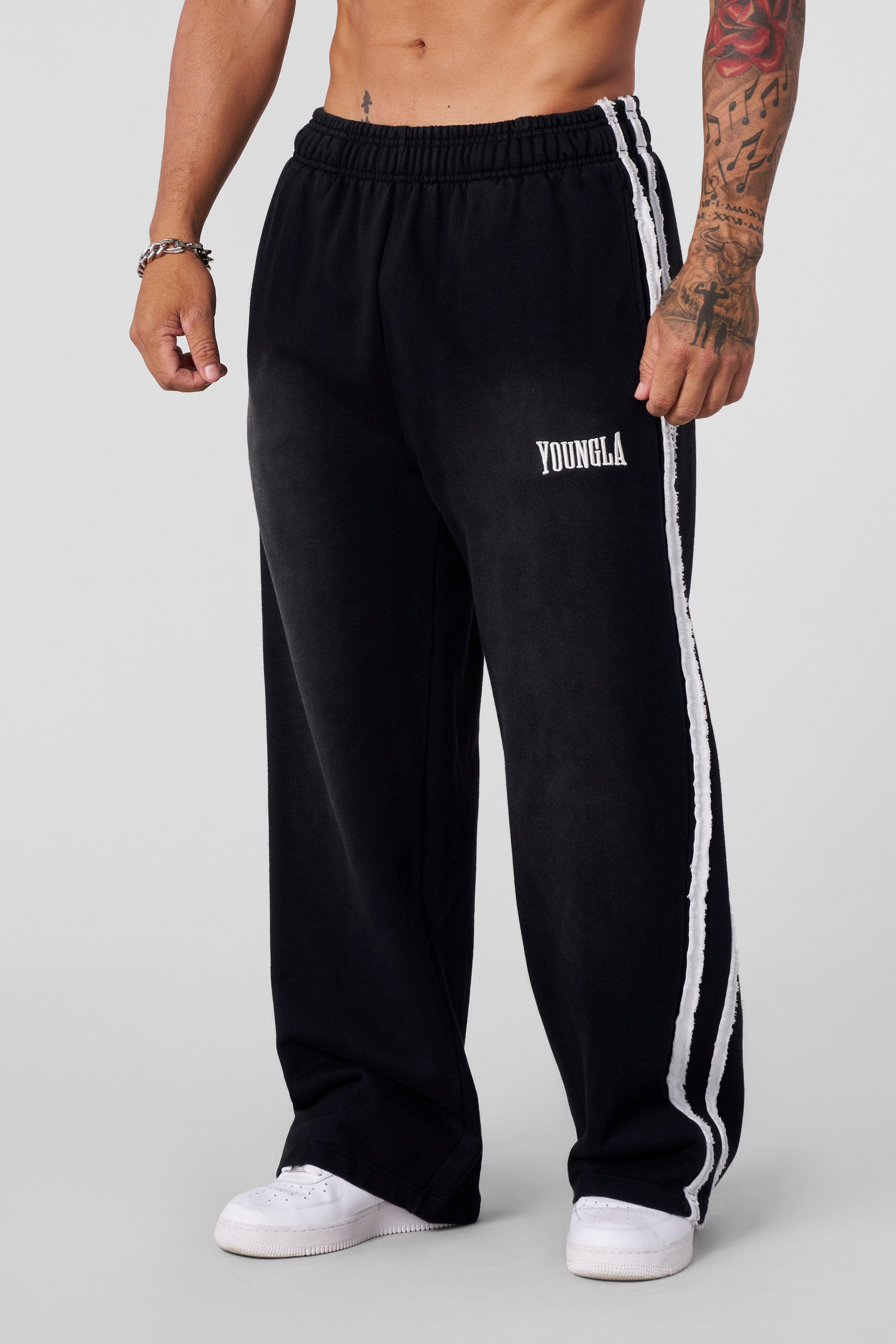 Full-body shot showcasing baggy fit with urban sneakers