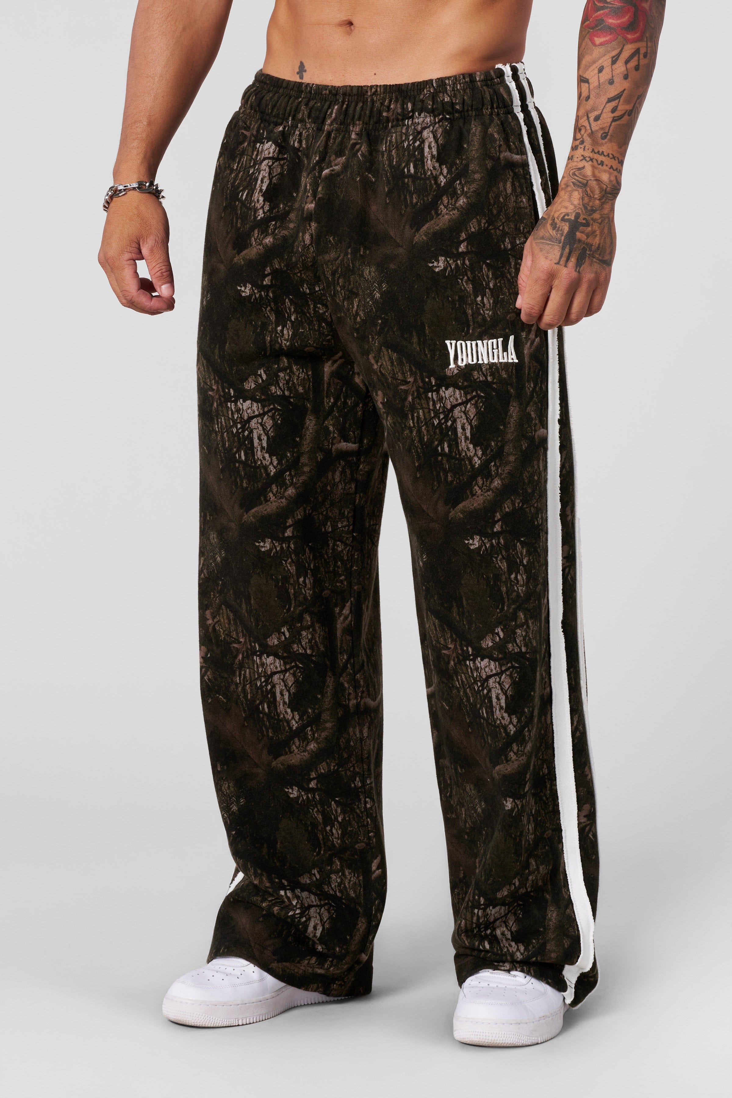 Close-up of striped sweatpants fabric texture and raw-cut detailing