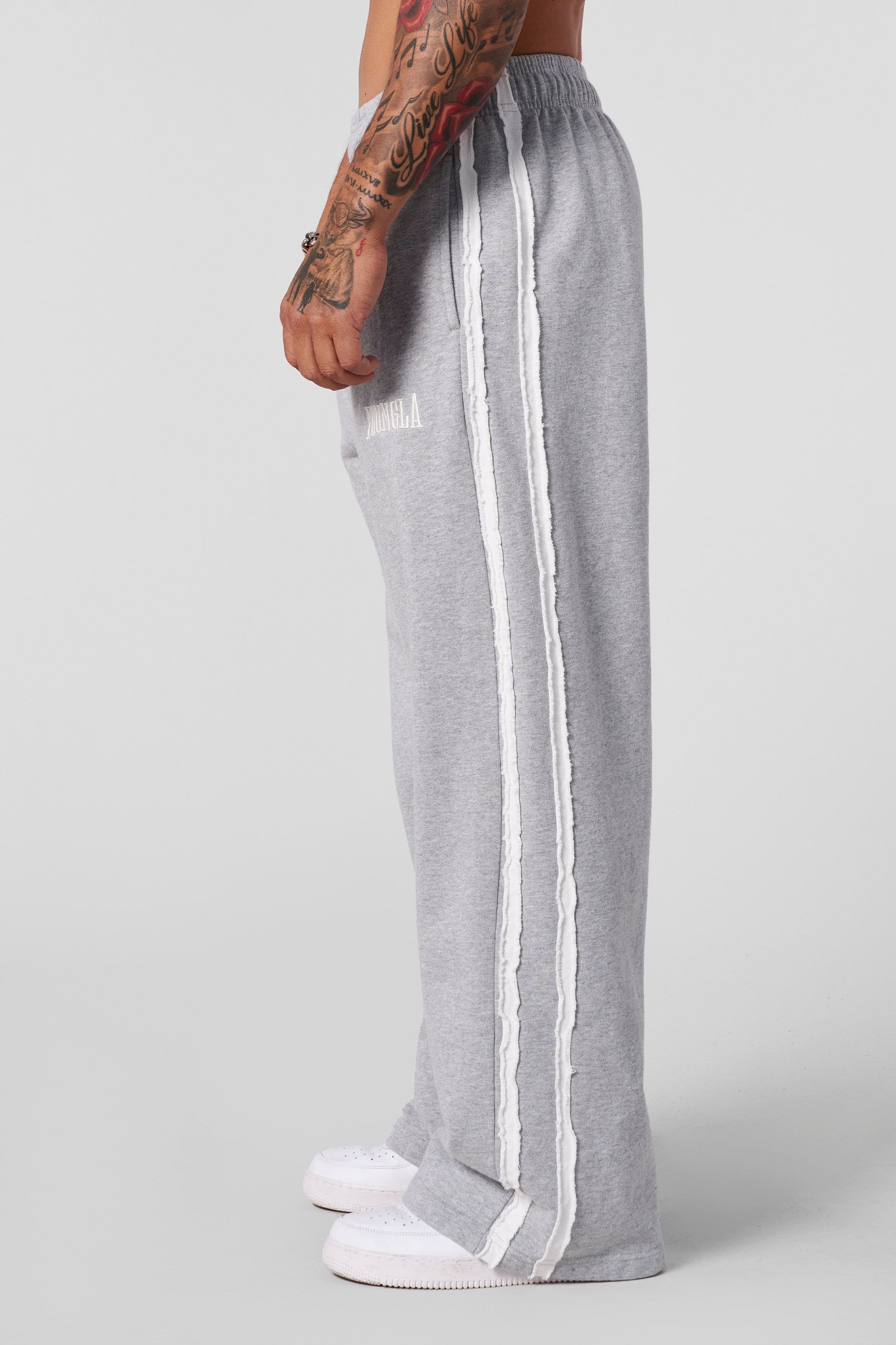 Full-body shot showcasing baggy fit with urban sneakers