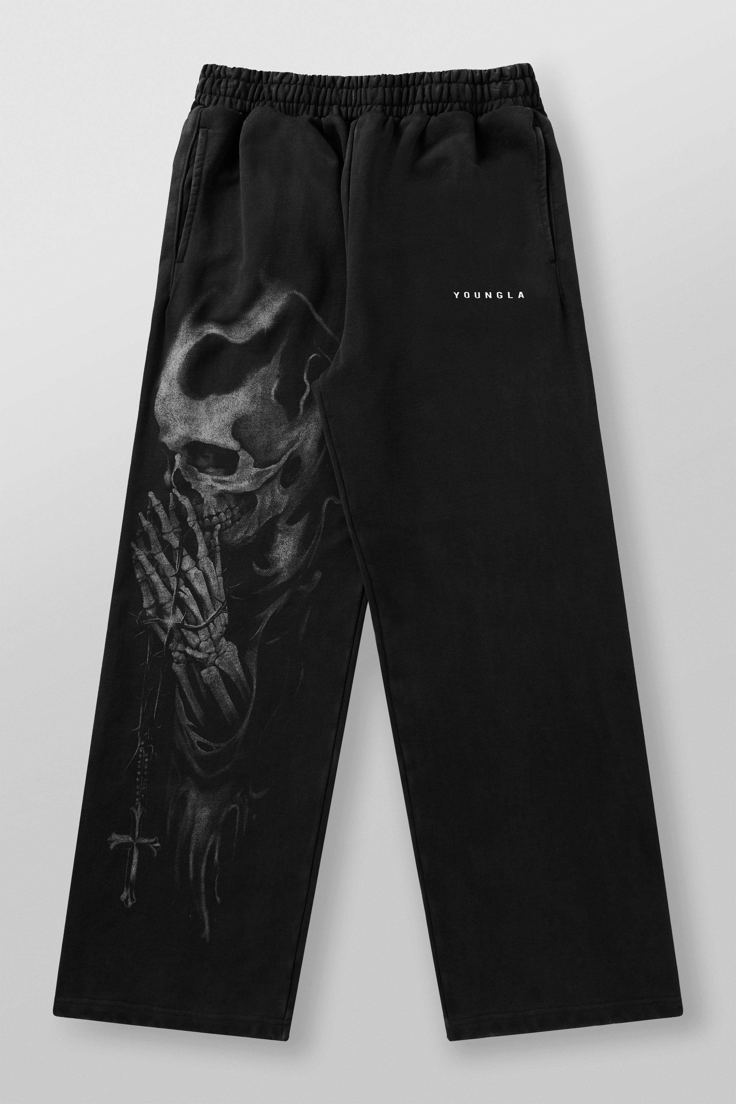 Close-up of skull graphic on black cotton sweatpants