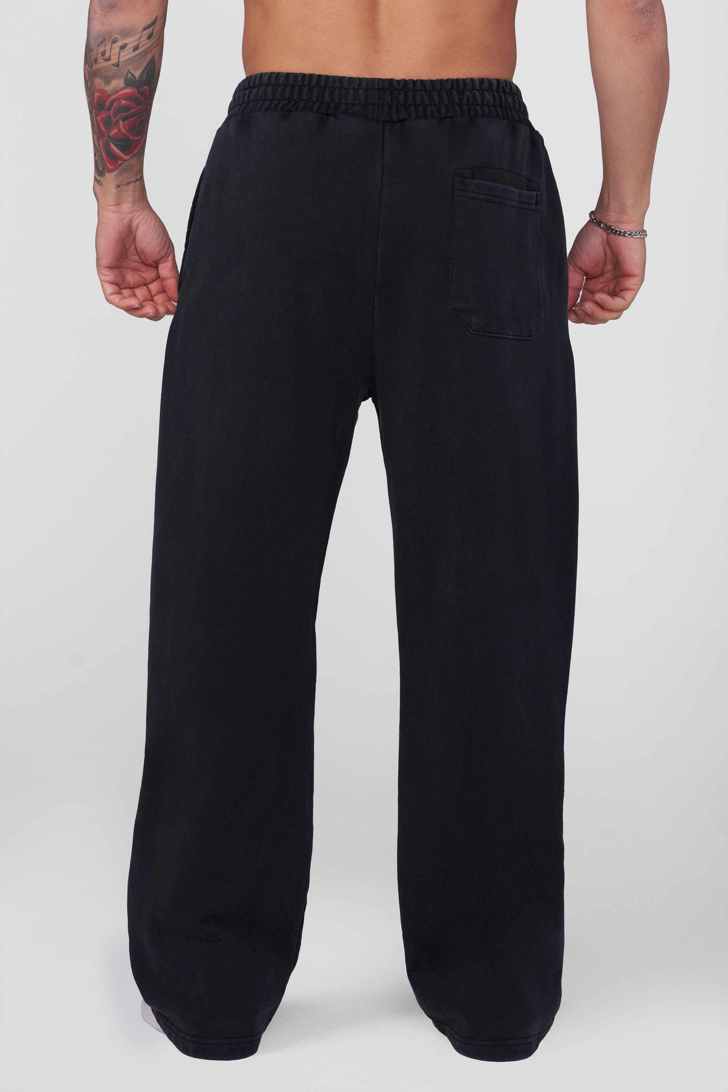 Model wearing baggy Divine Sweats in urban setting