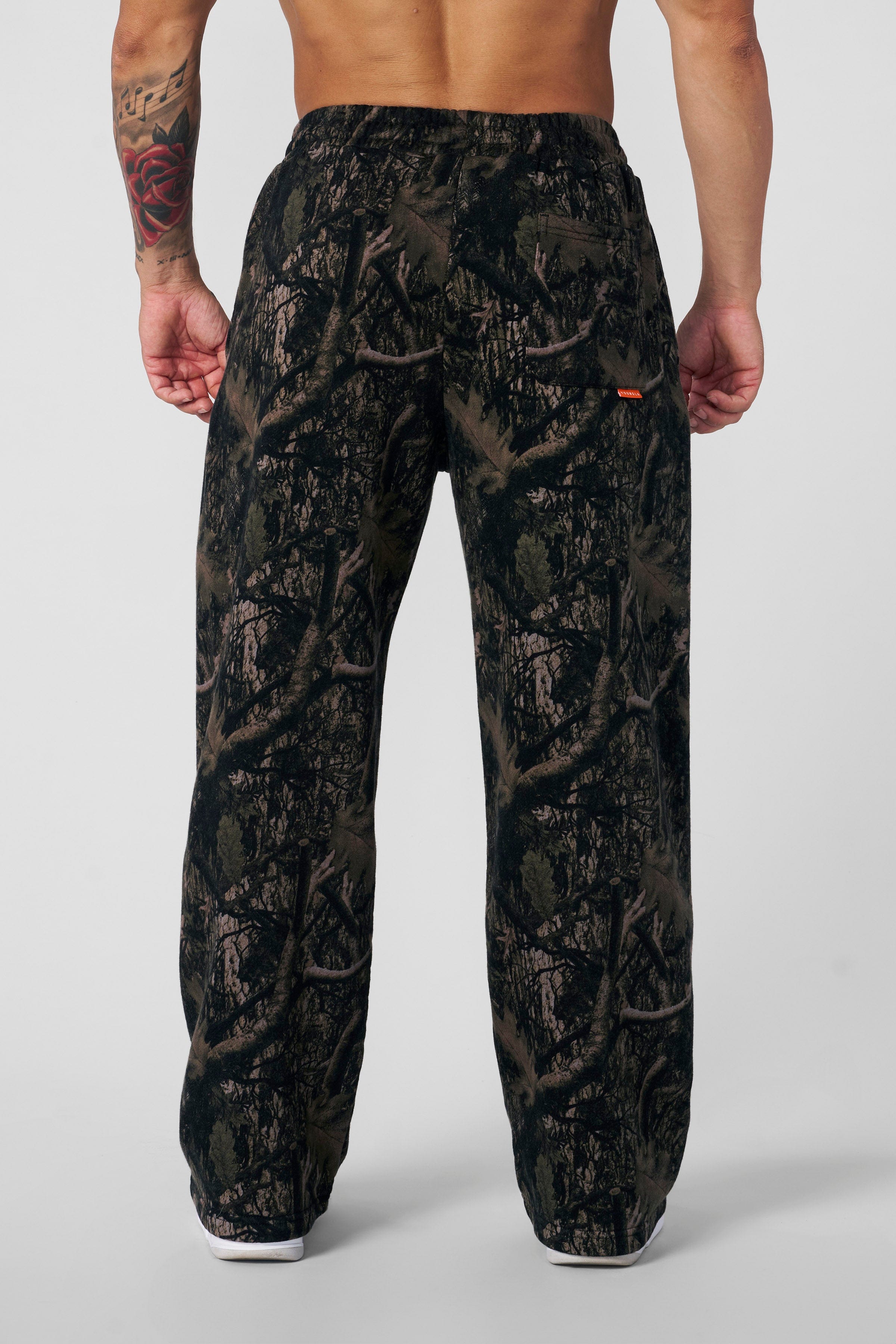 Close-up of the tree camo pattern on the sweatpants fabric.