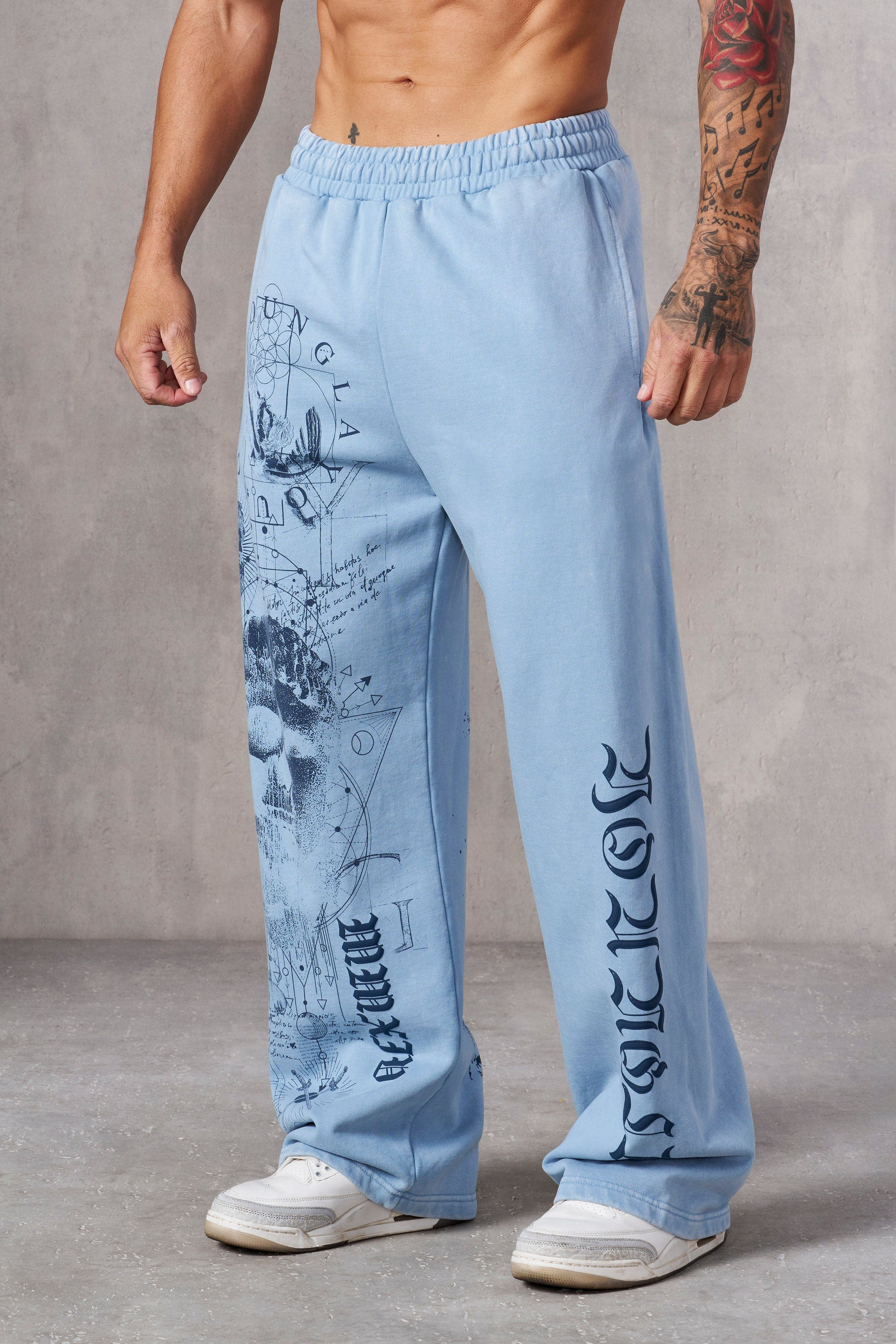 Close-up of fabric texture and detailed print on baggy sweat pants