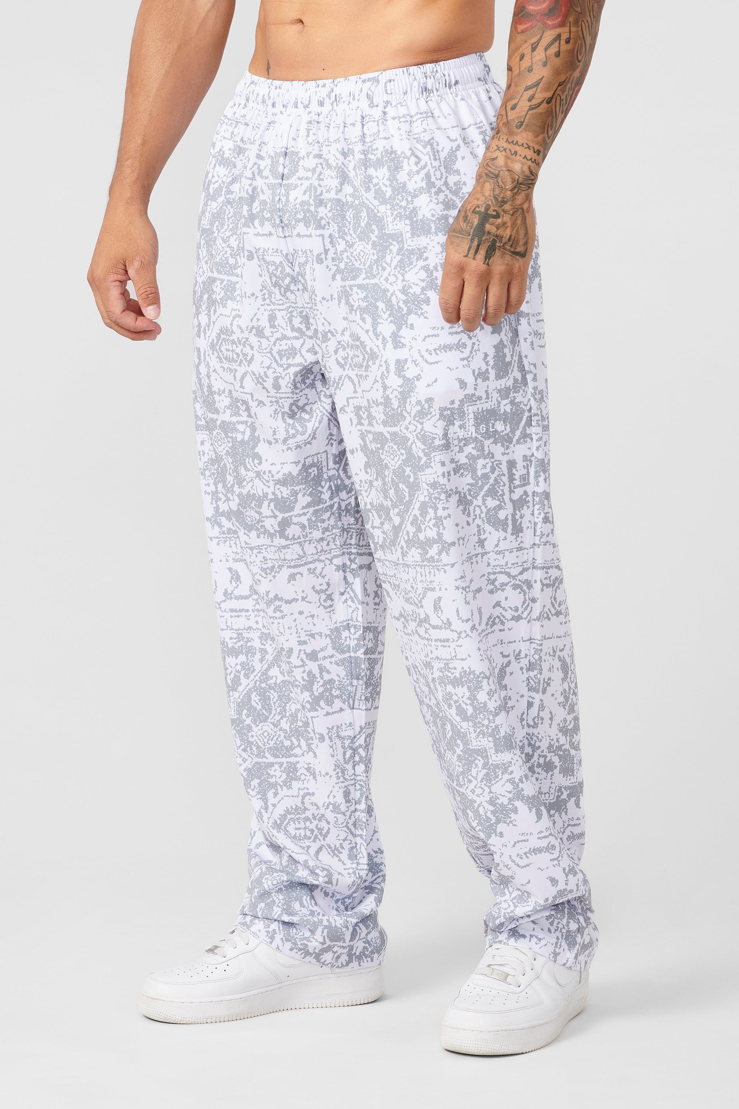 Front view of vintage bodybuilding style loose fit cargo pants with bold print