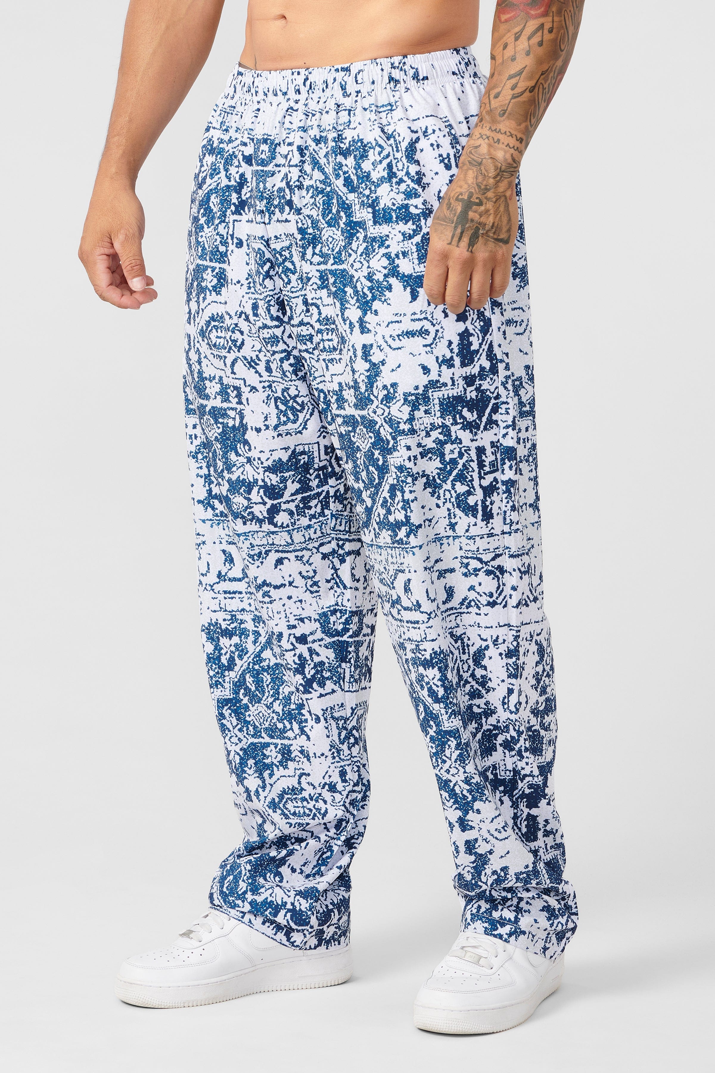 Front view of vintage bodybuilding style loose fit cargo pants with bold print
