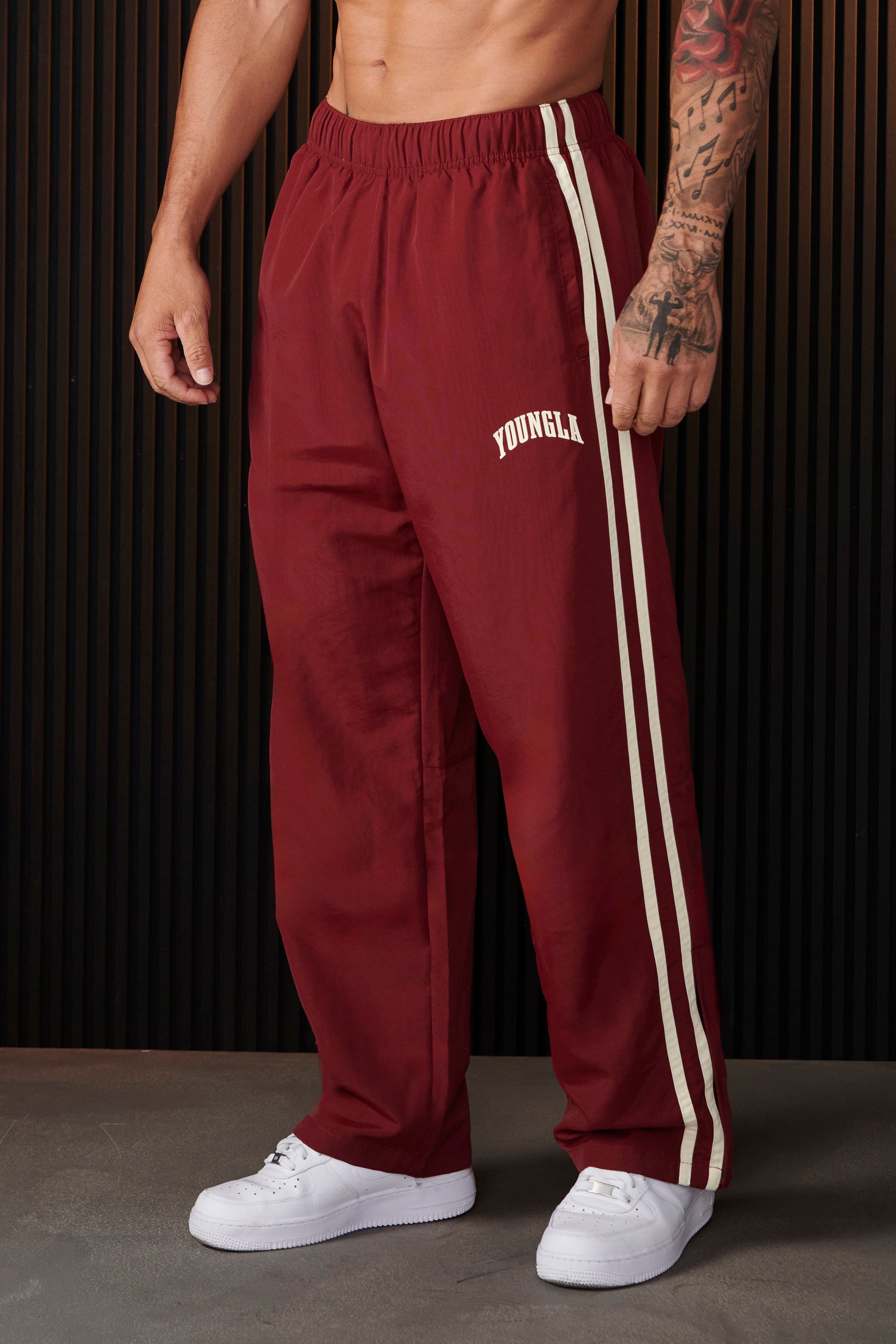 Model wearing black joggers, perfect for casual outings or lounging.