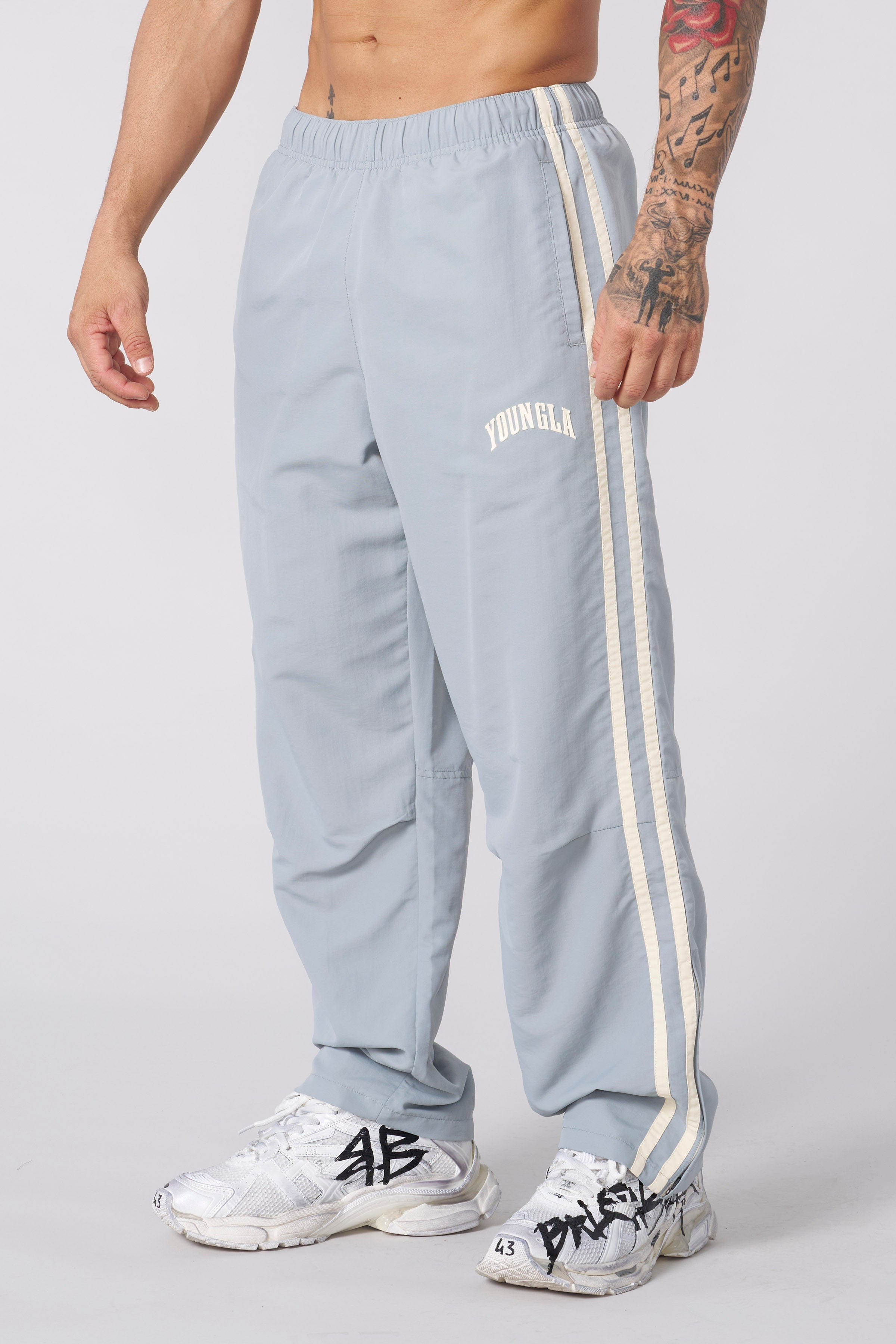 Model wearing black joggers, perfect for casual outings or lounging.