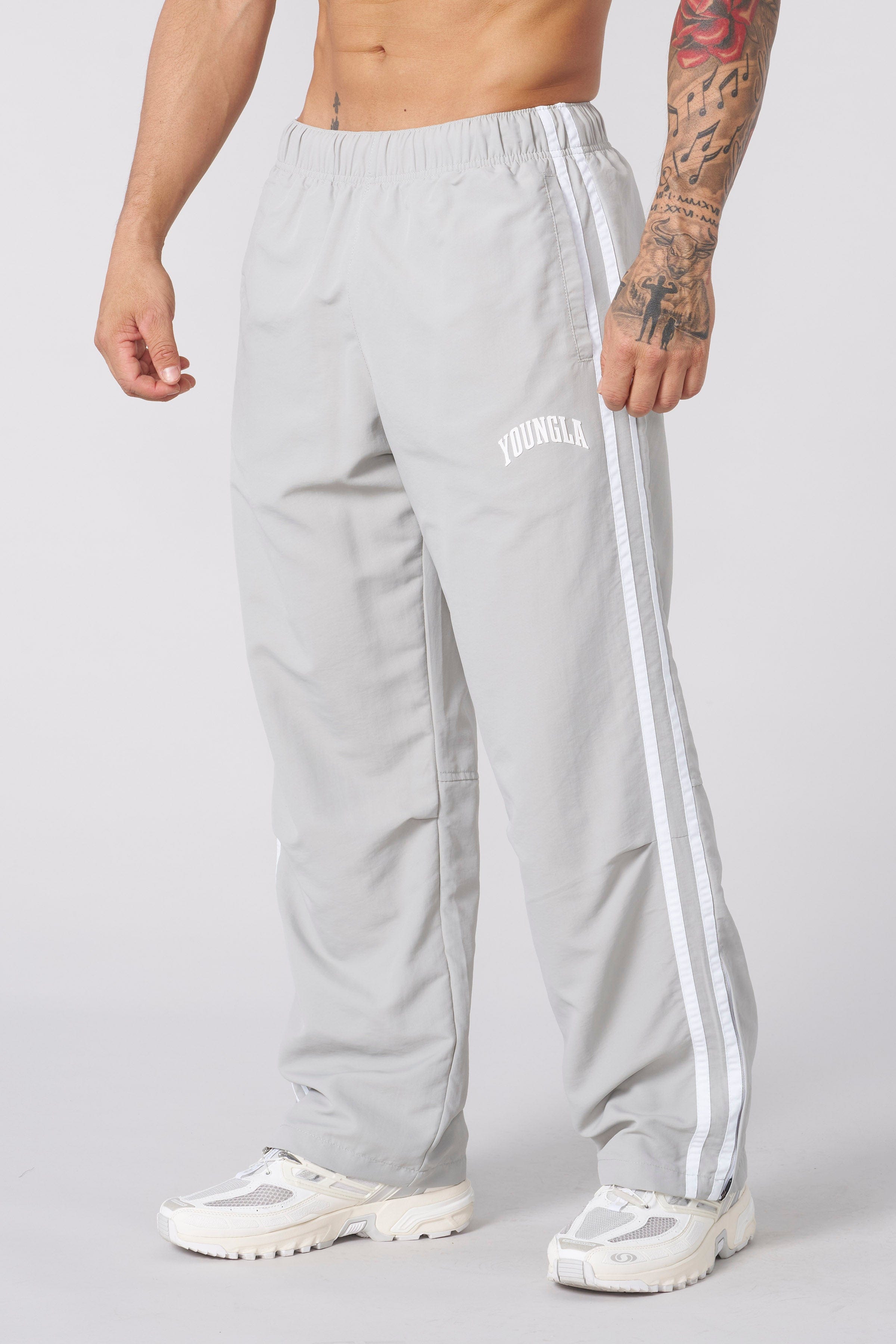 Model wearing black joggers, perfect for casual outings or lounging.