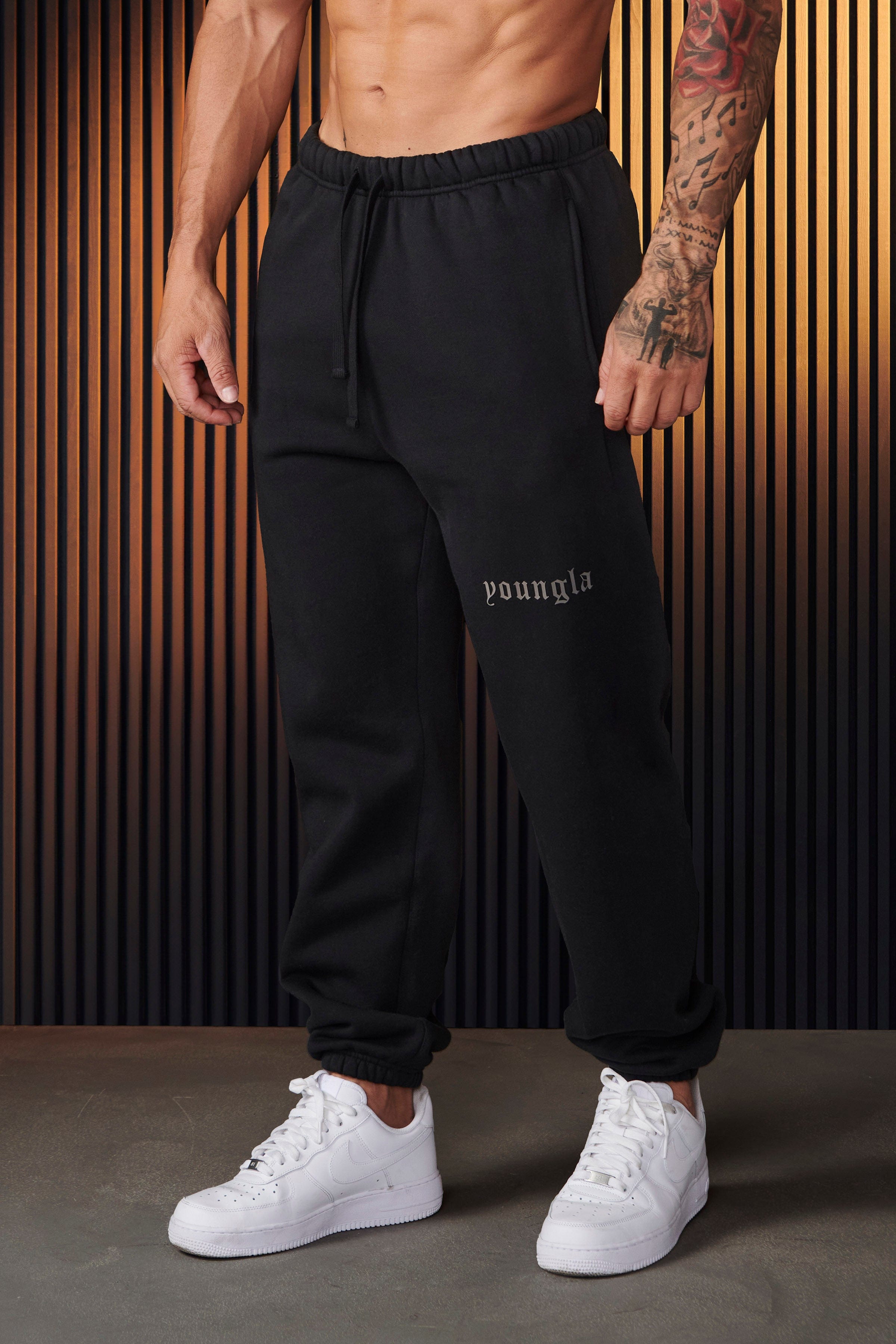Model wearing Nike mens tech fleece joggers, highlighting their comfort and style.