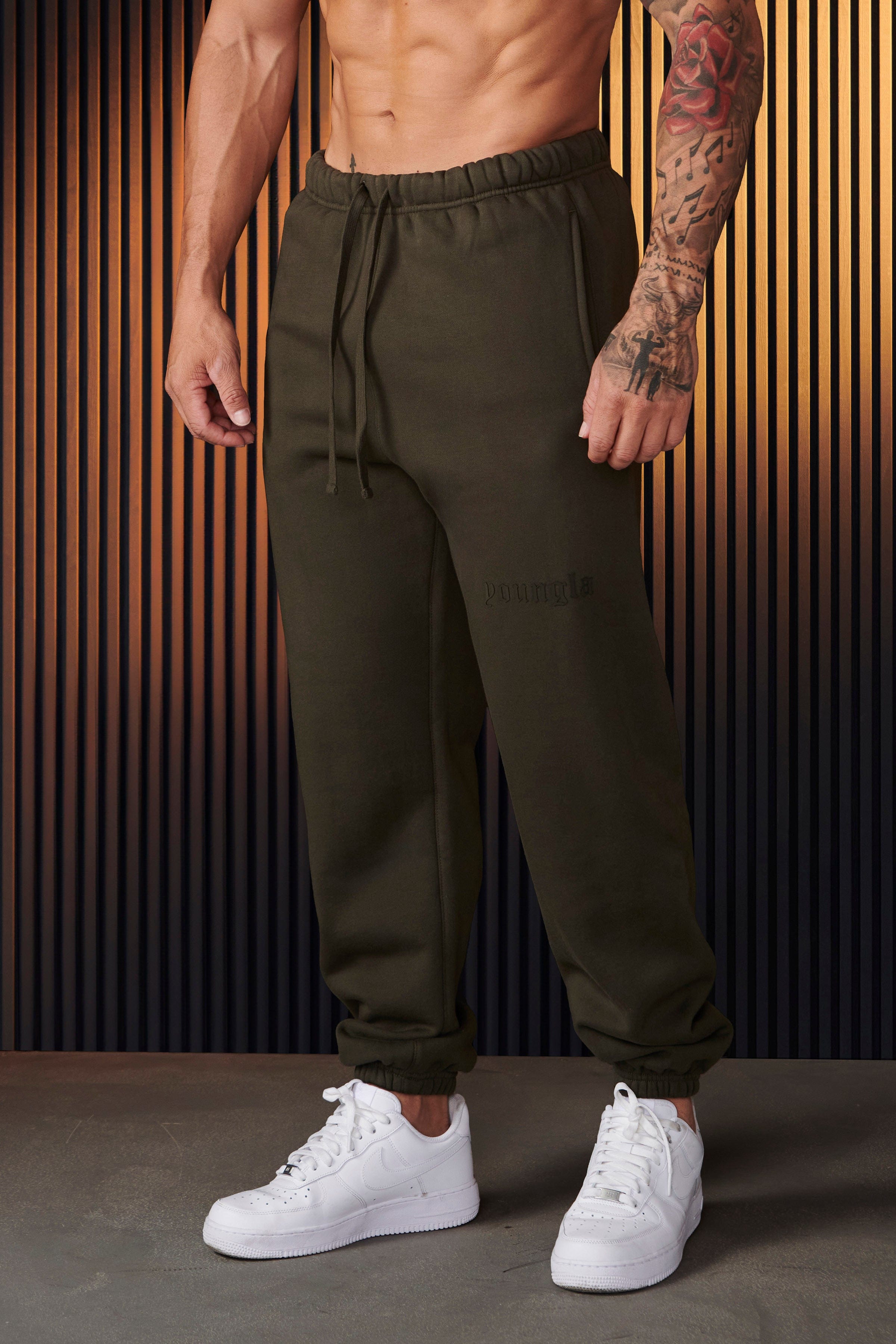 Side angle of mens UA Rival fleece joggers perfect for casual outings.