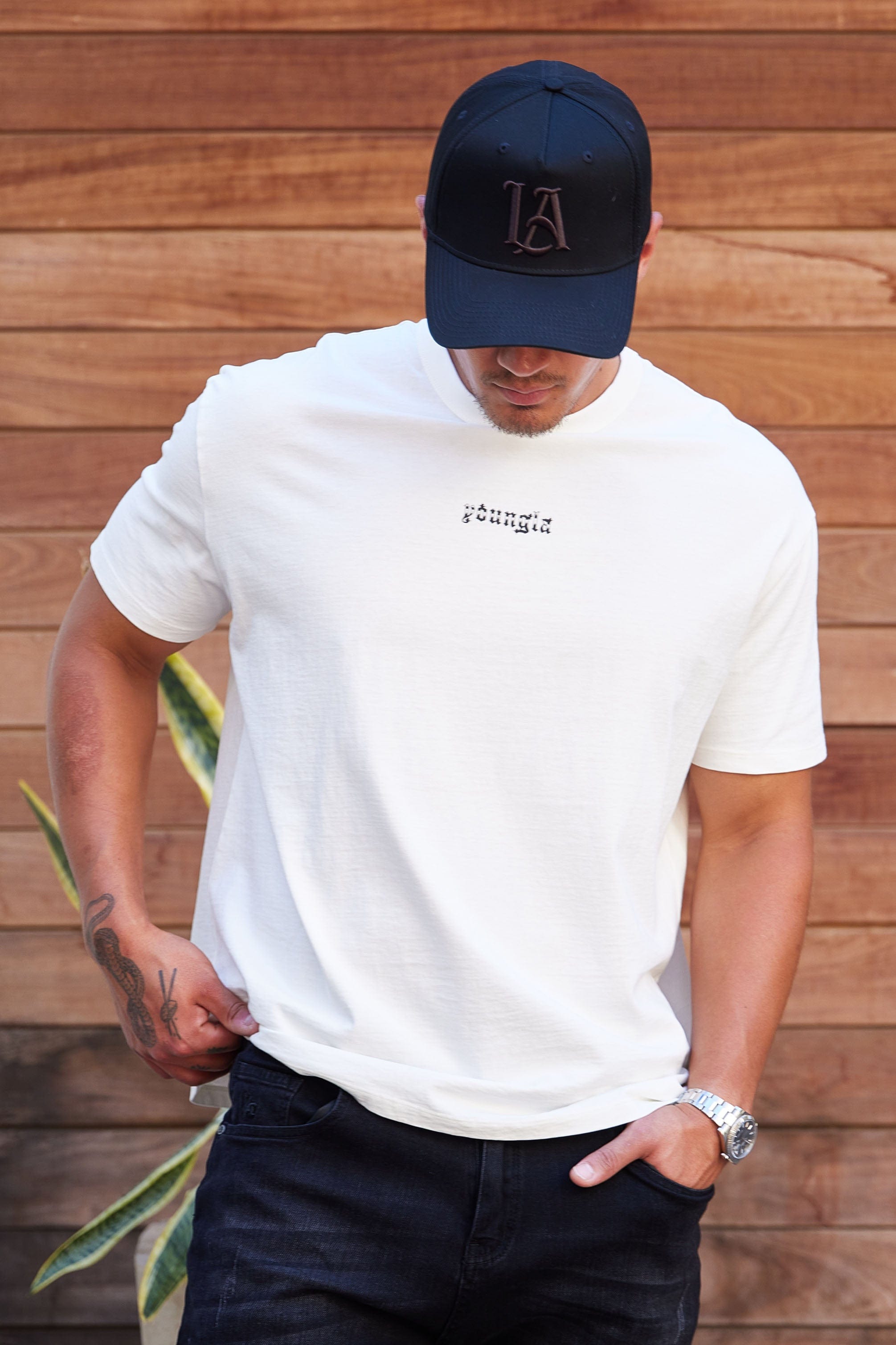 Front view of embroidered baseball hat with a structured A-Frame silhouette and detailed stitching.