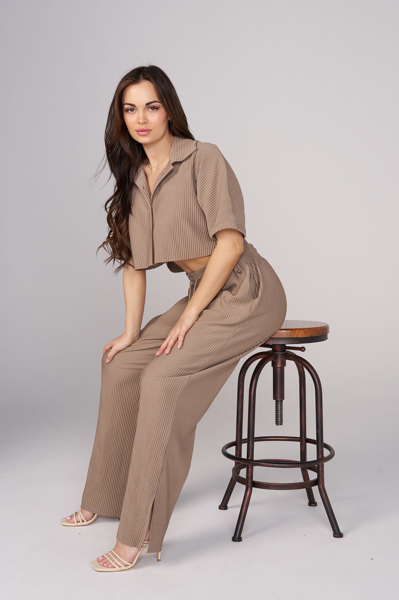 Close-up of the pleated details on the Aria top, perfect for formal outings.