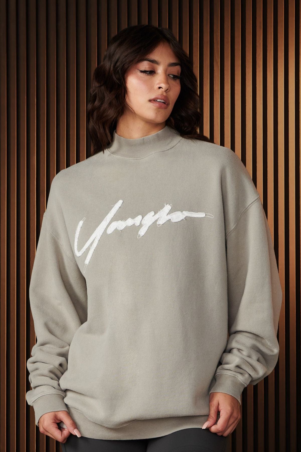 Close-up of the high neck and textured terry fabric of the crewneck sweatshirt