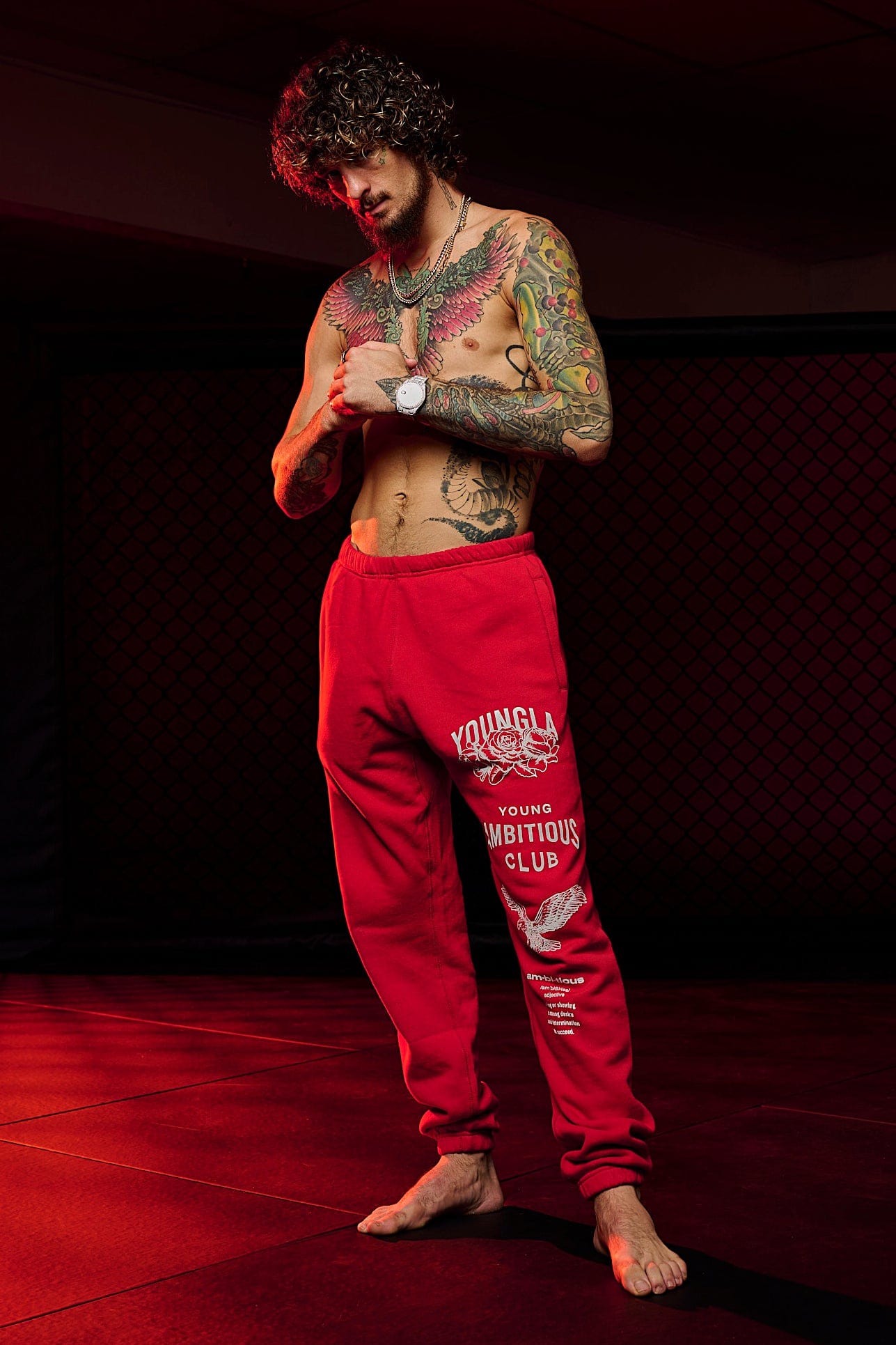 Front angle view of mens joggers showcasing oversized fit and printed leg design