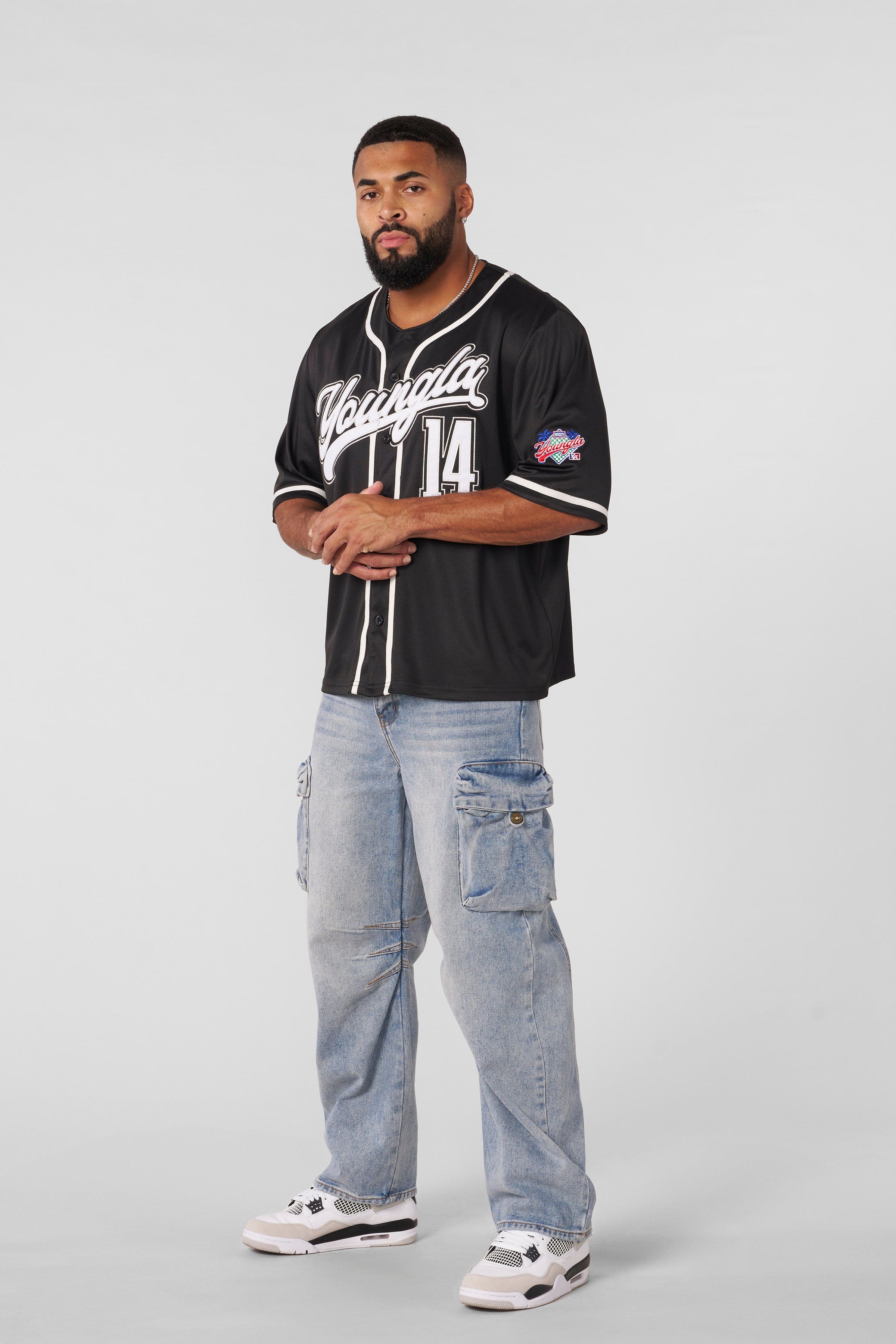 Model wearing the Grand Slam jersey, demonstrating its relaxed fit.