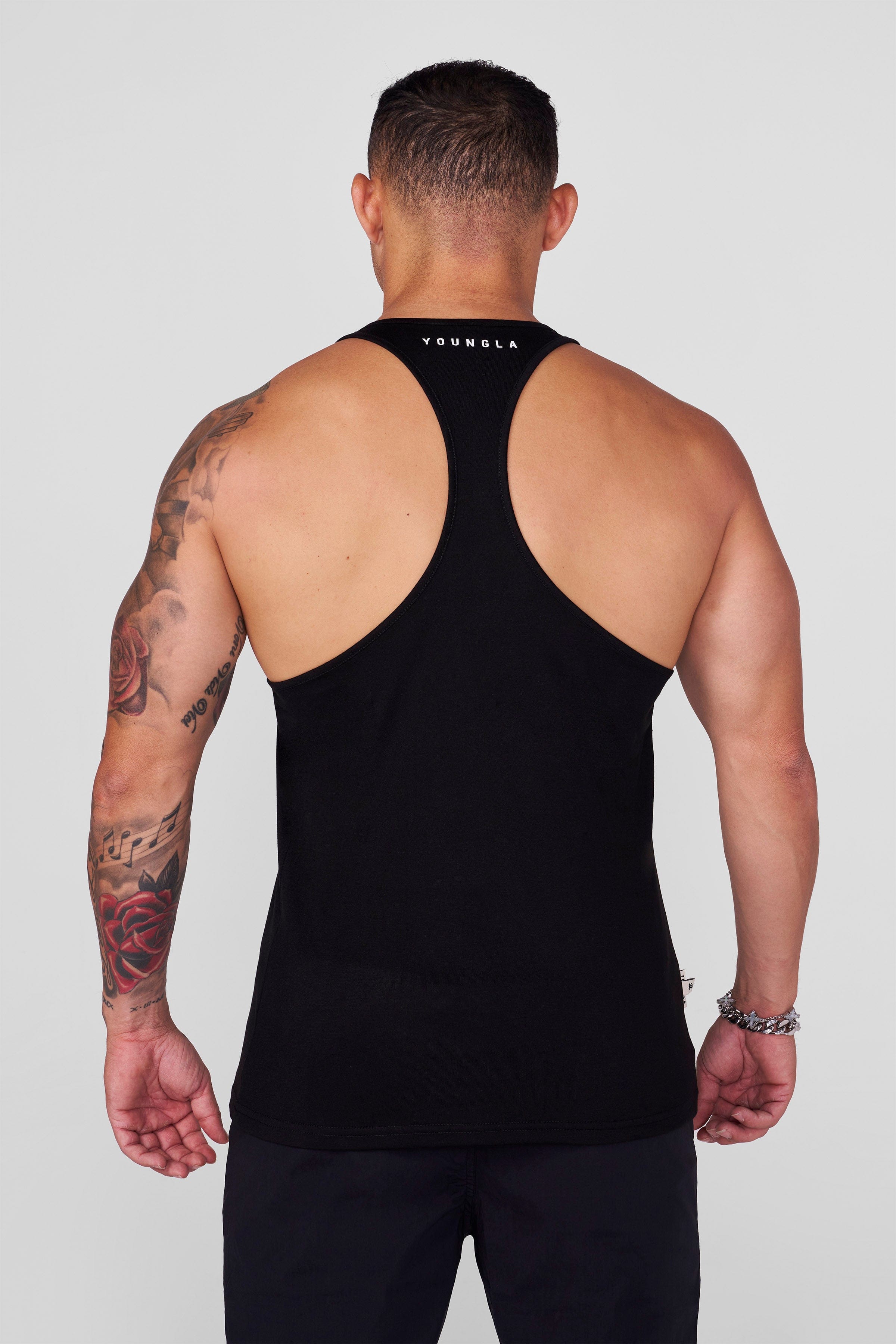 Front view of black mens gym stringer tank for intense upper body training