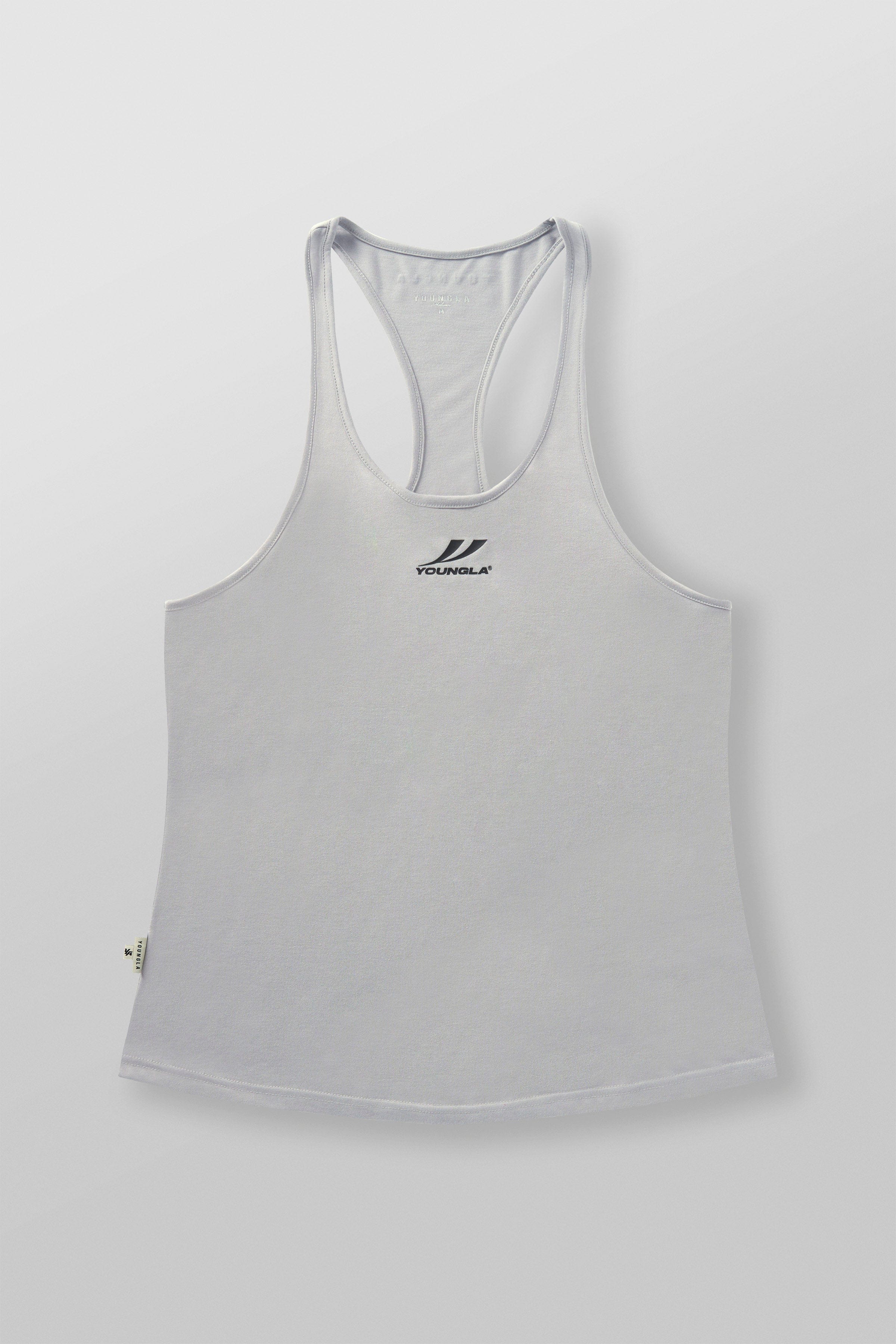 Model showcasing mens workout tank top while lifting weights outdoors