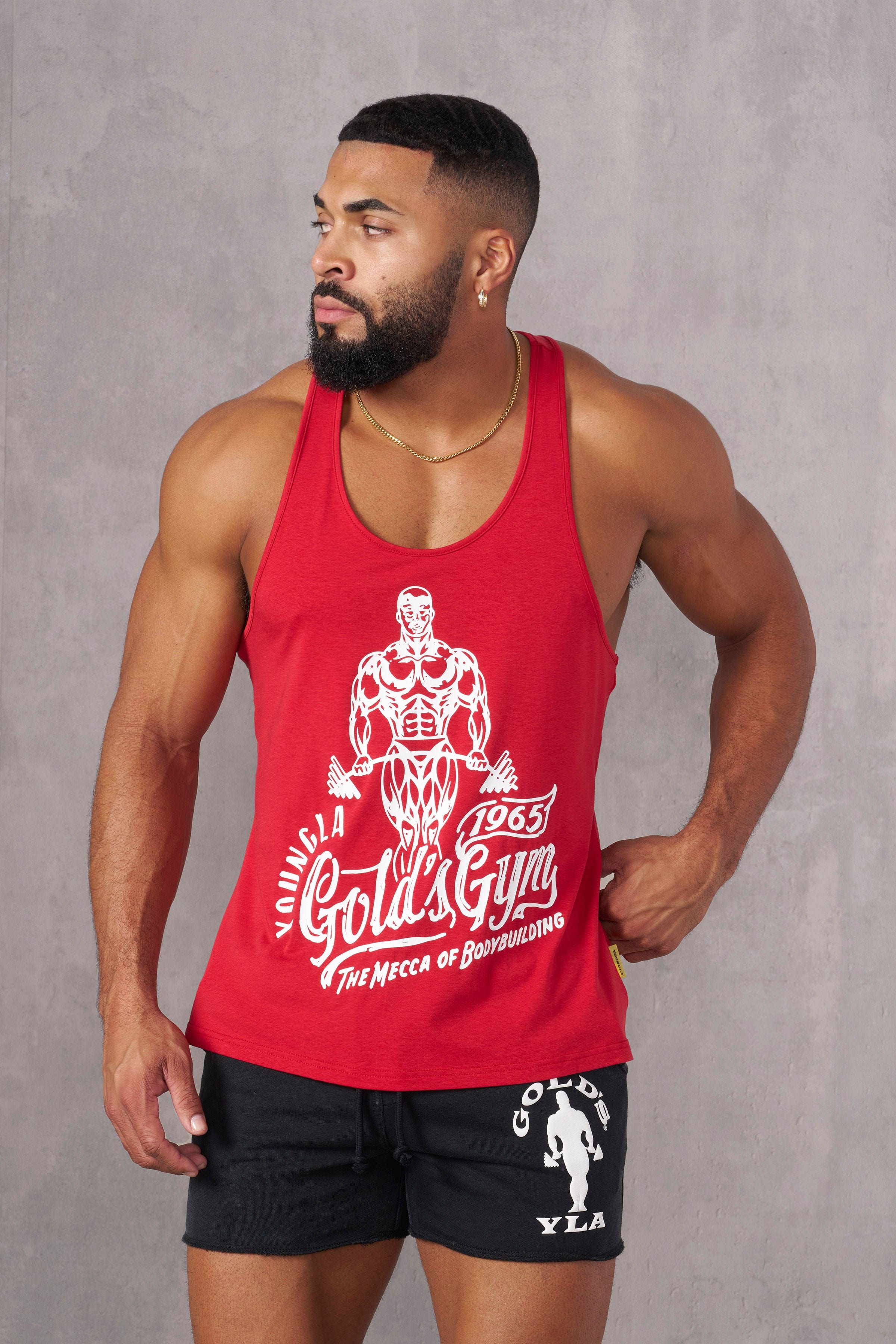 Back view of the Golds Gym stringer tank top on a model at the gym.