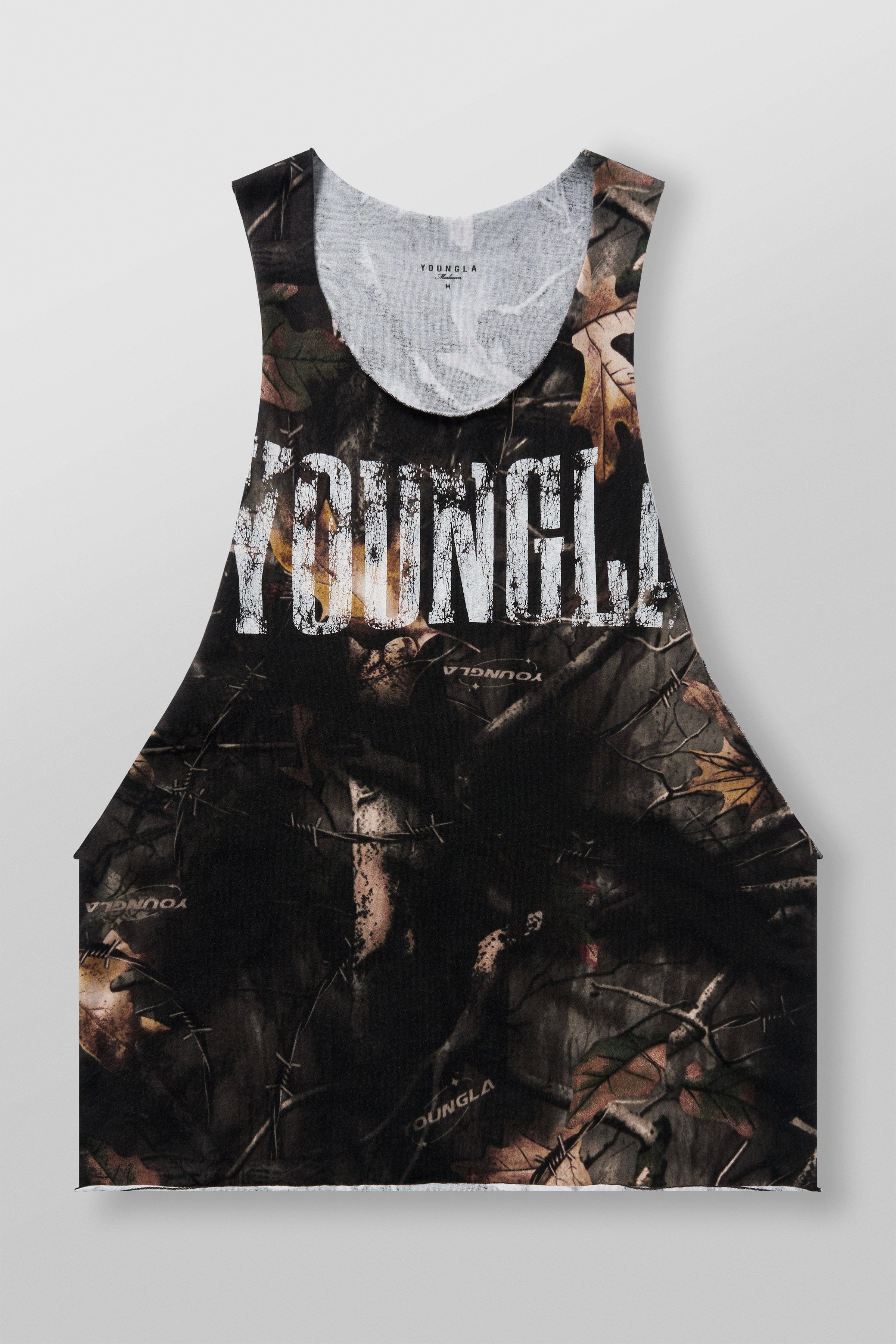 Raw hem sleeveless workout shirt shown mid-rep inside Detroit weight room