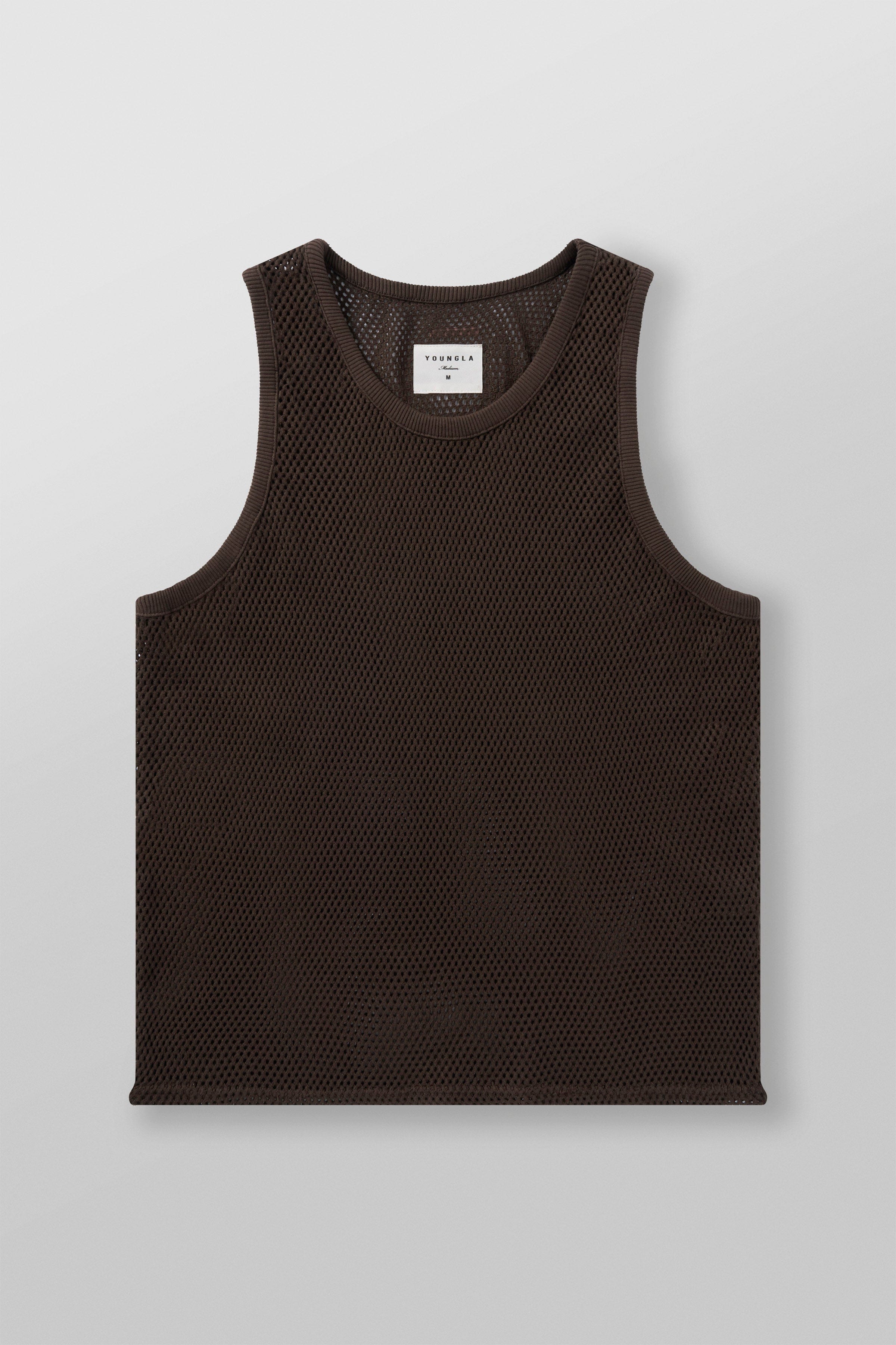 Stylish pairing of the tank top with summer shorts.