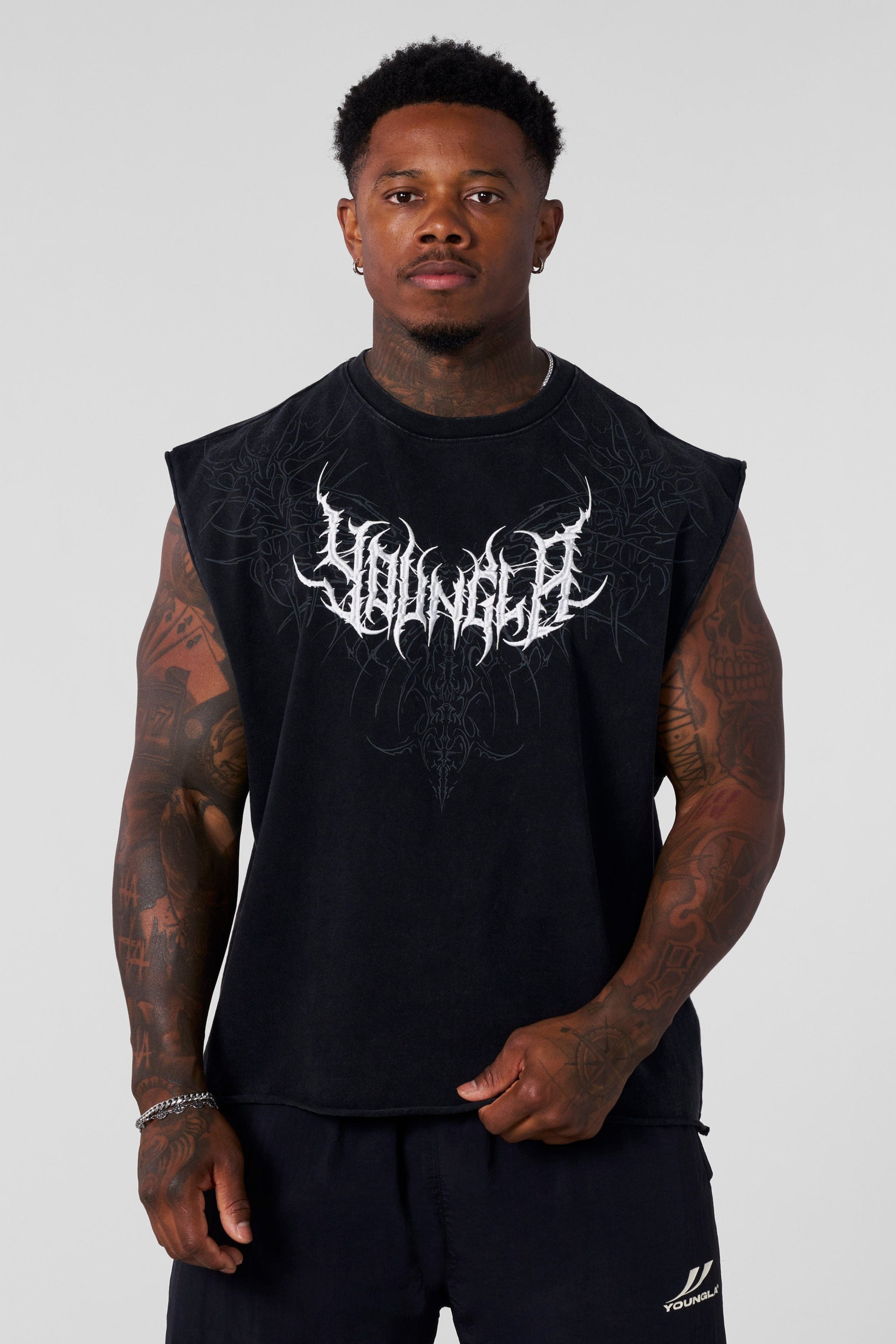 Front view of Dark Wave sleeveless graphic t-shirt with tribal print.