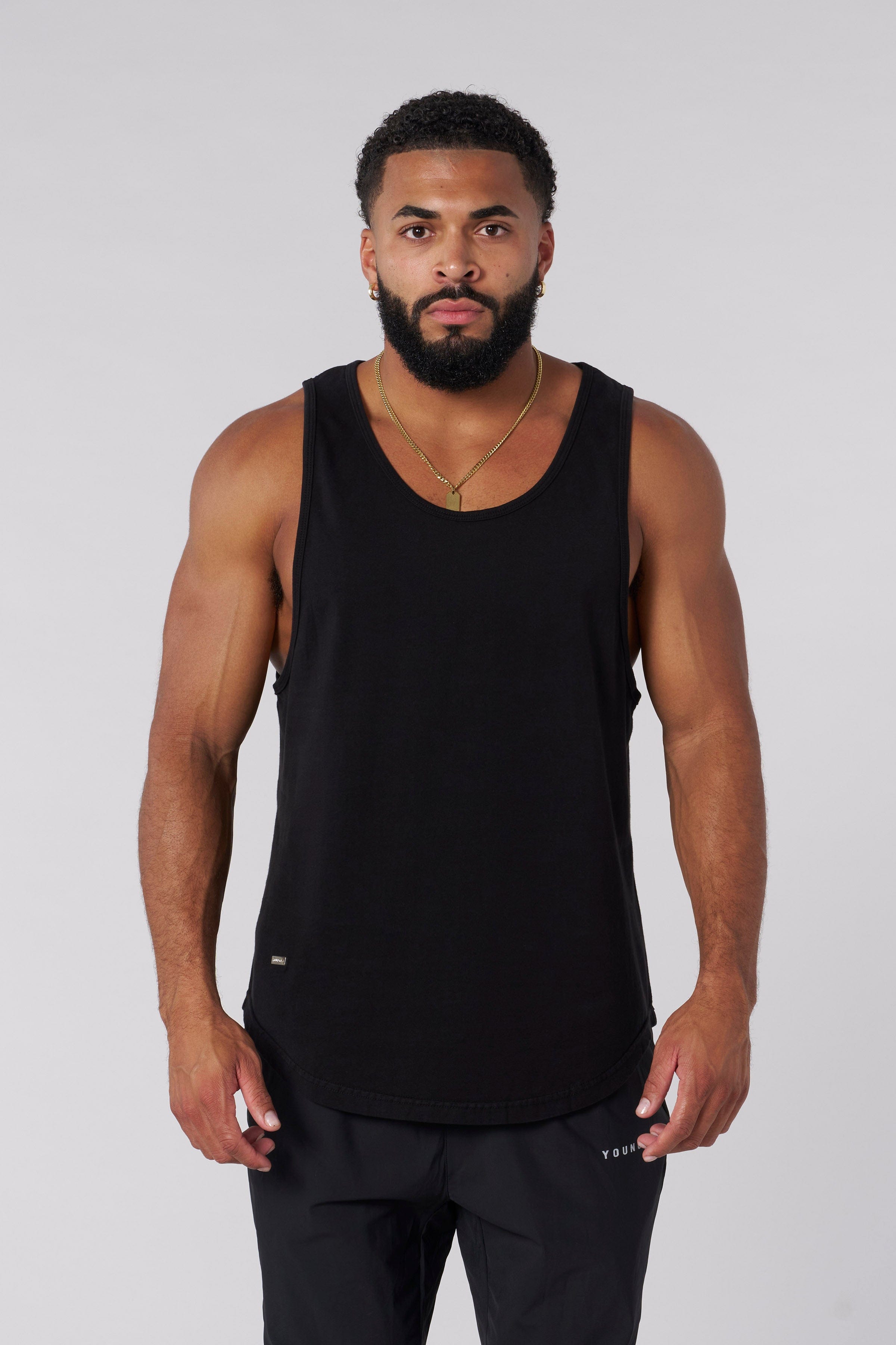 Casual outing in a stylish white tank top for men.