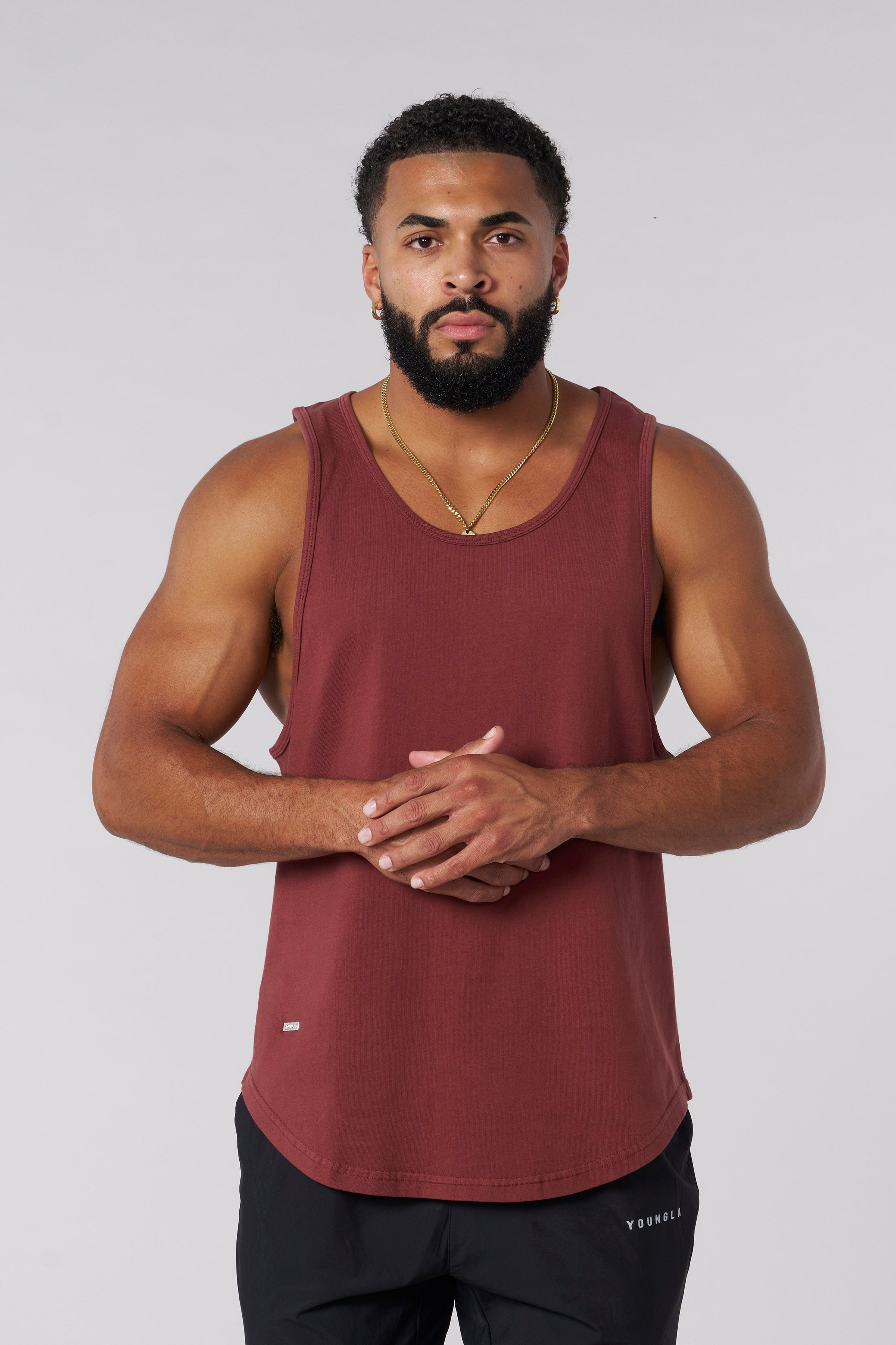 Model showcasing a black tank top paired with shorts.