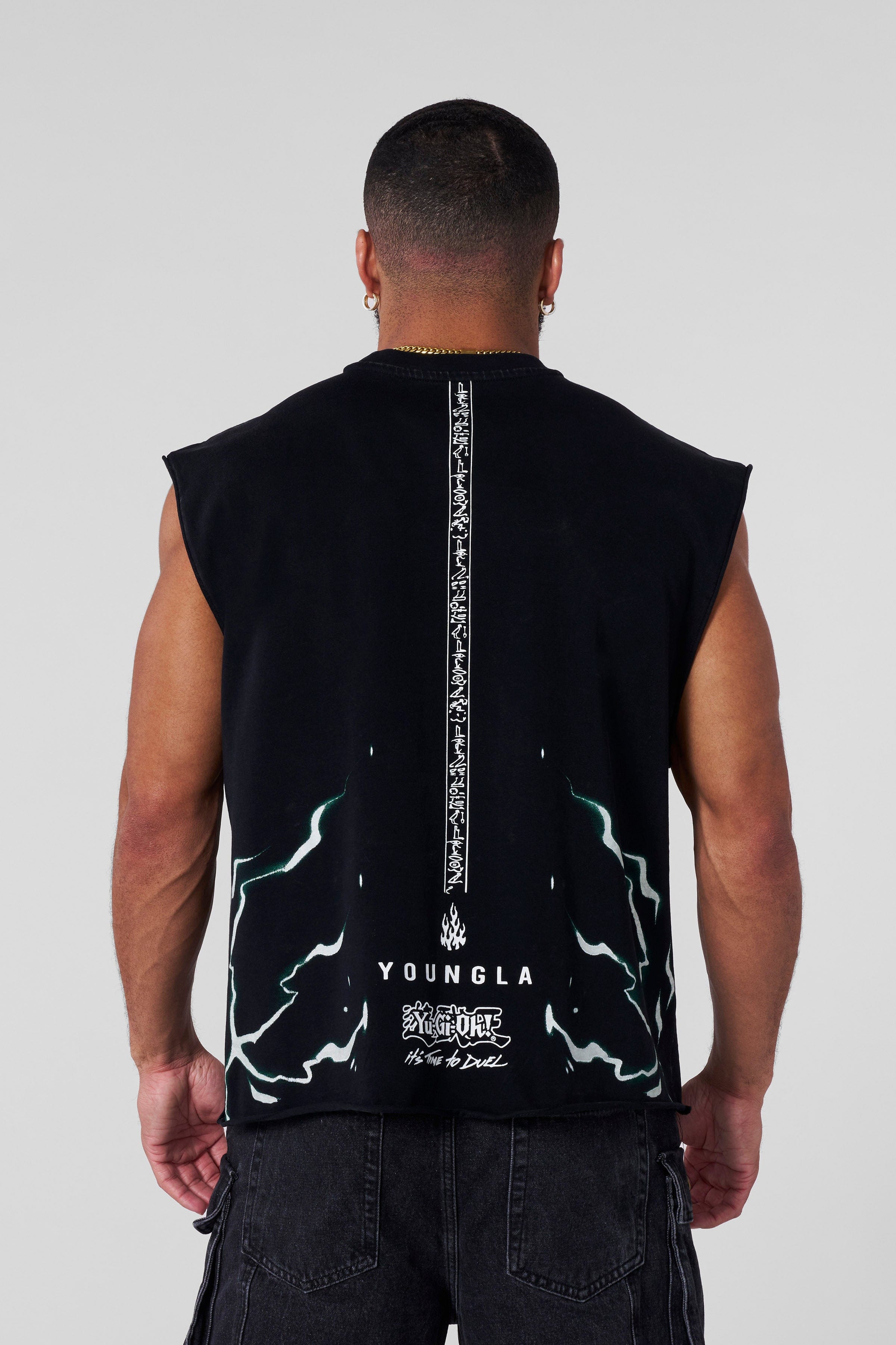 Streetwear model wearing anime tank top with relaxed fit