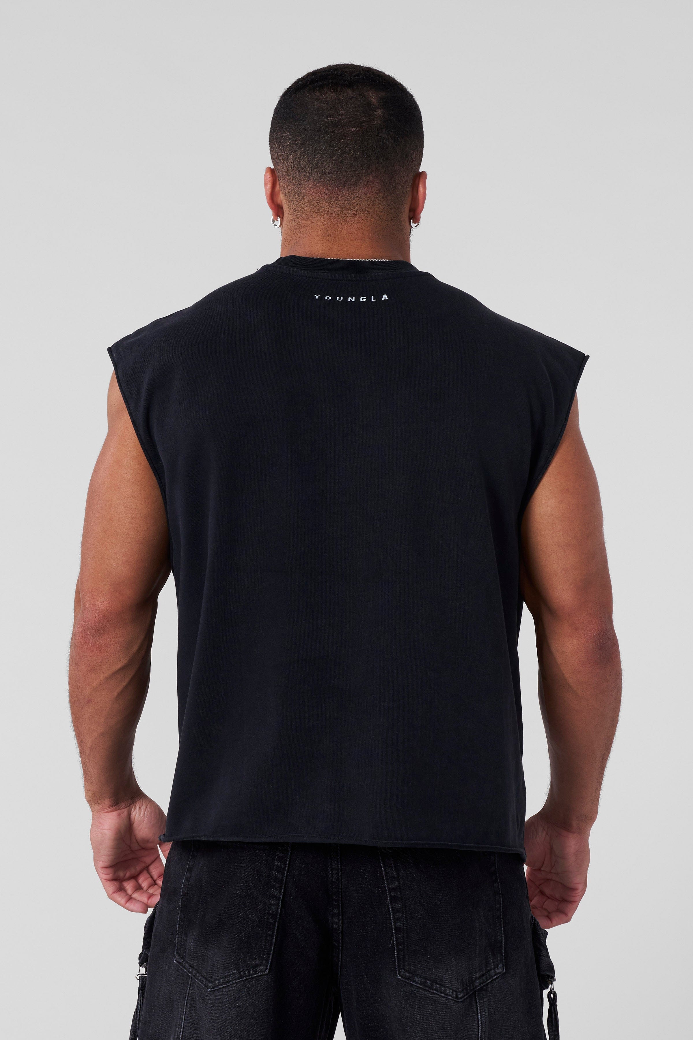 Close-up of mens cut-off tank top showing distressed fabric and logo