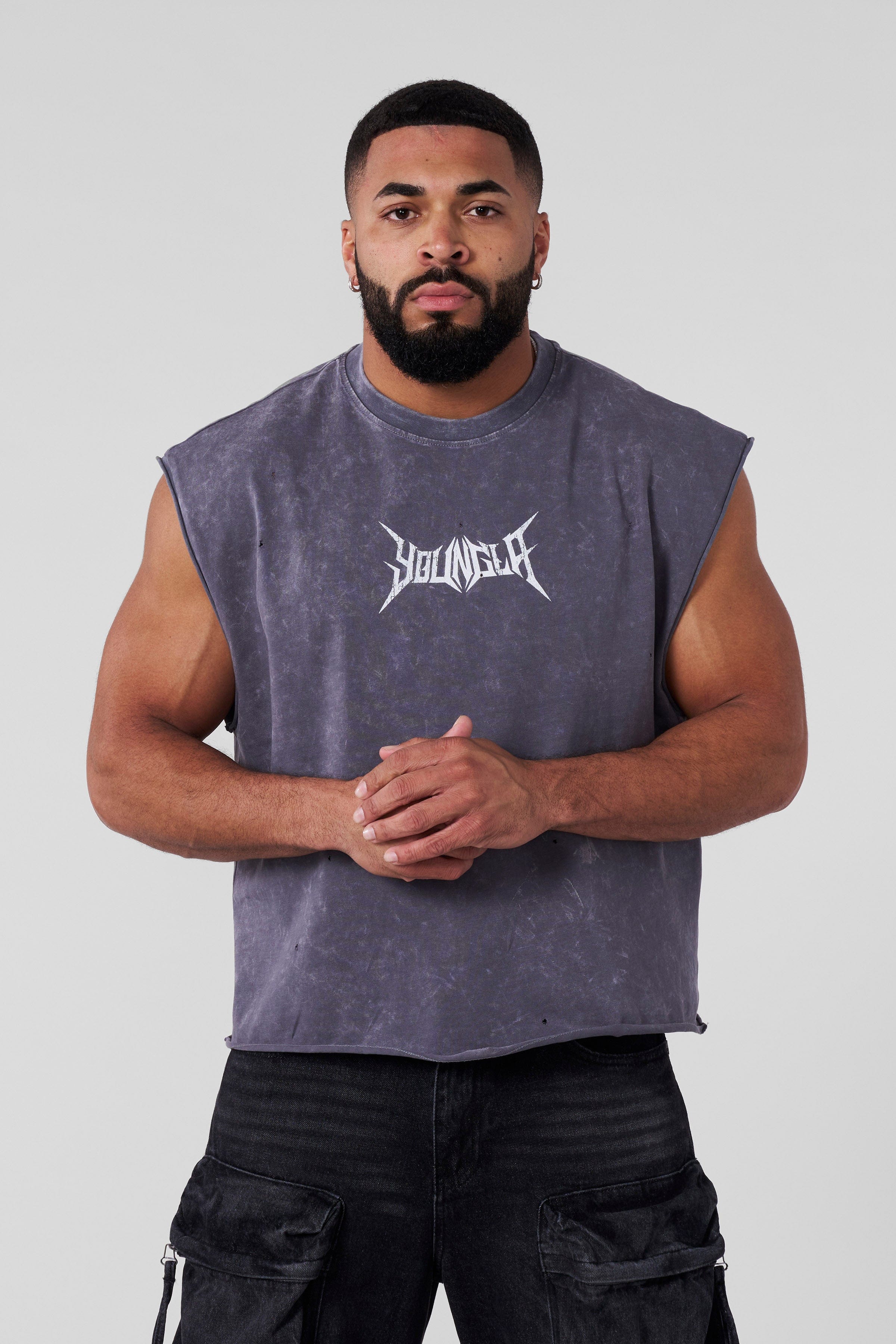 Close-up of mens cut-off tank top showing distressed fabric and logo