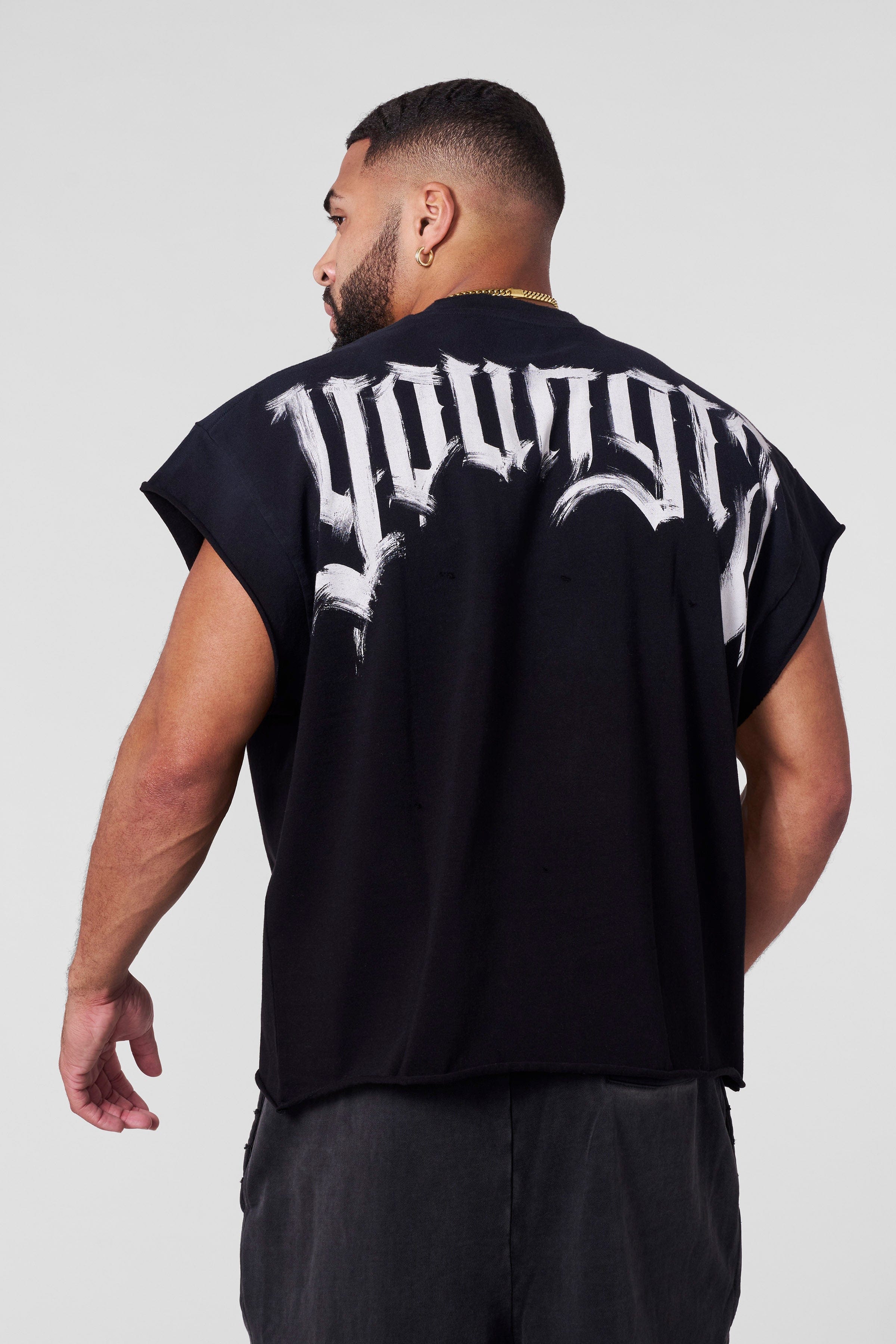 Closeup of shoulder drop shirt neckline and upper fade wash texture
