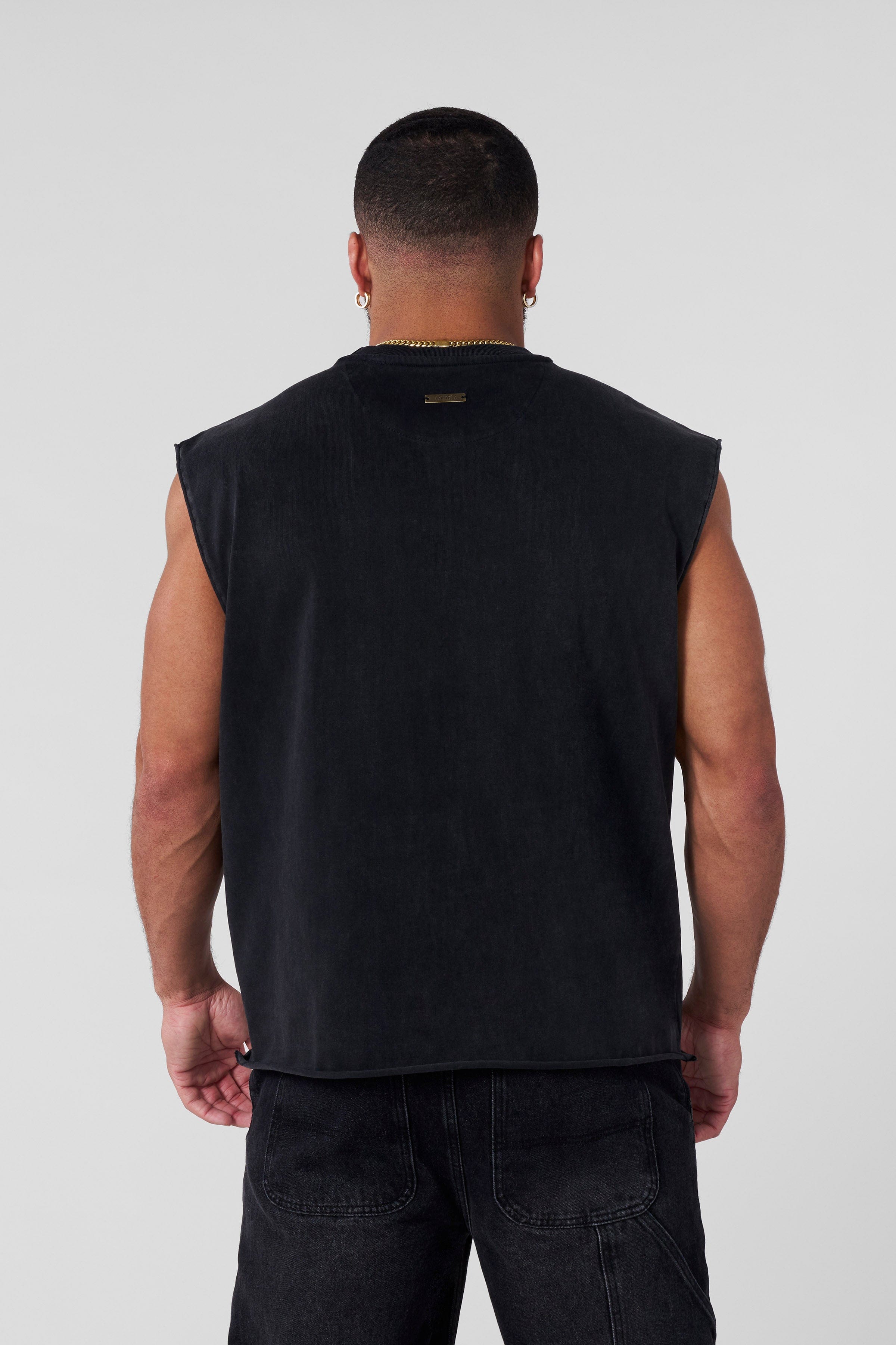 Back view of YoungLA Cut-Off Shirt demonstrating its stylish design.