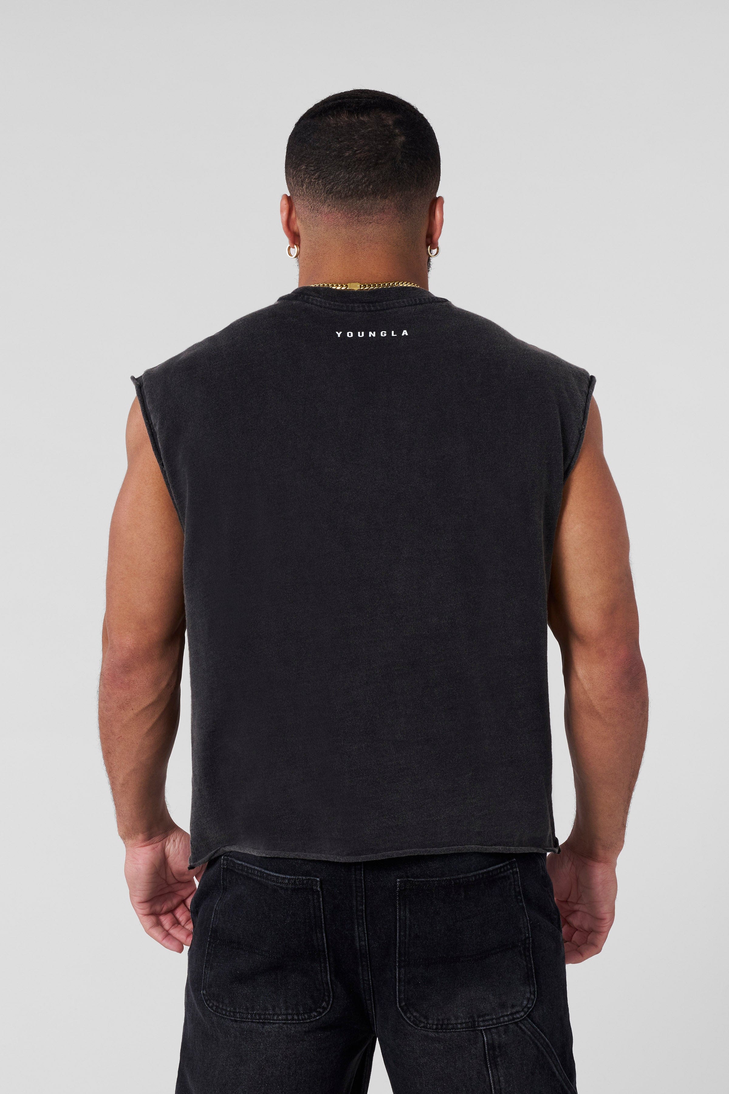 Close-up of slub cotton texture and raw-cut sleeve detail