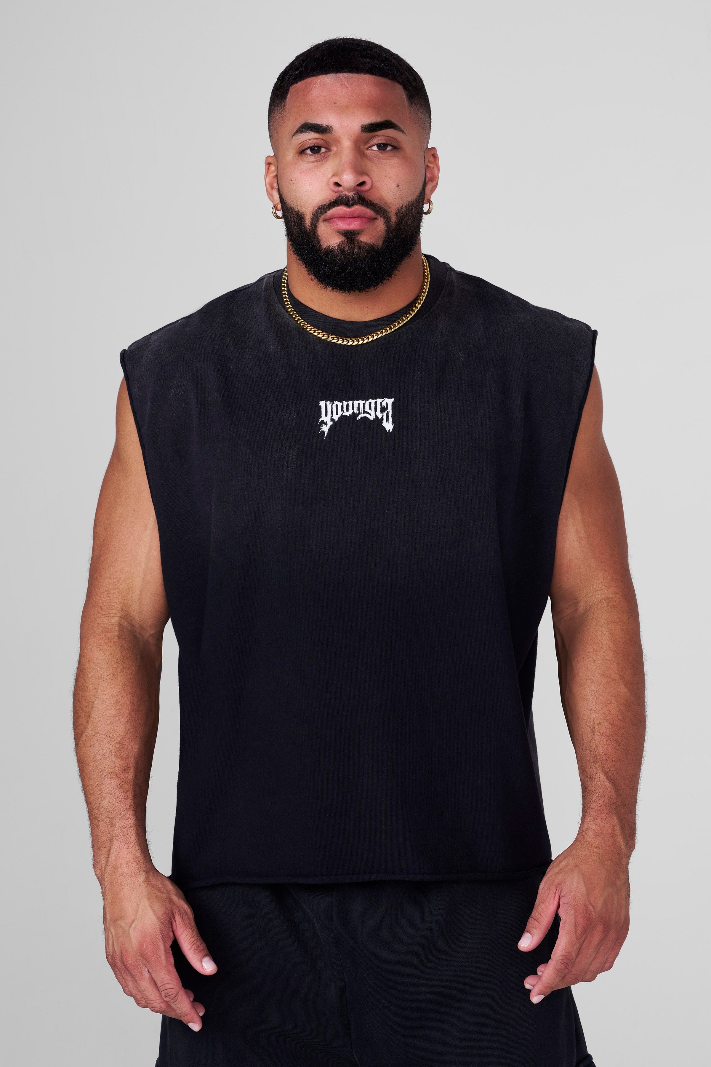 Side view of graphic shorts men styled with street sneakers
