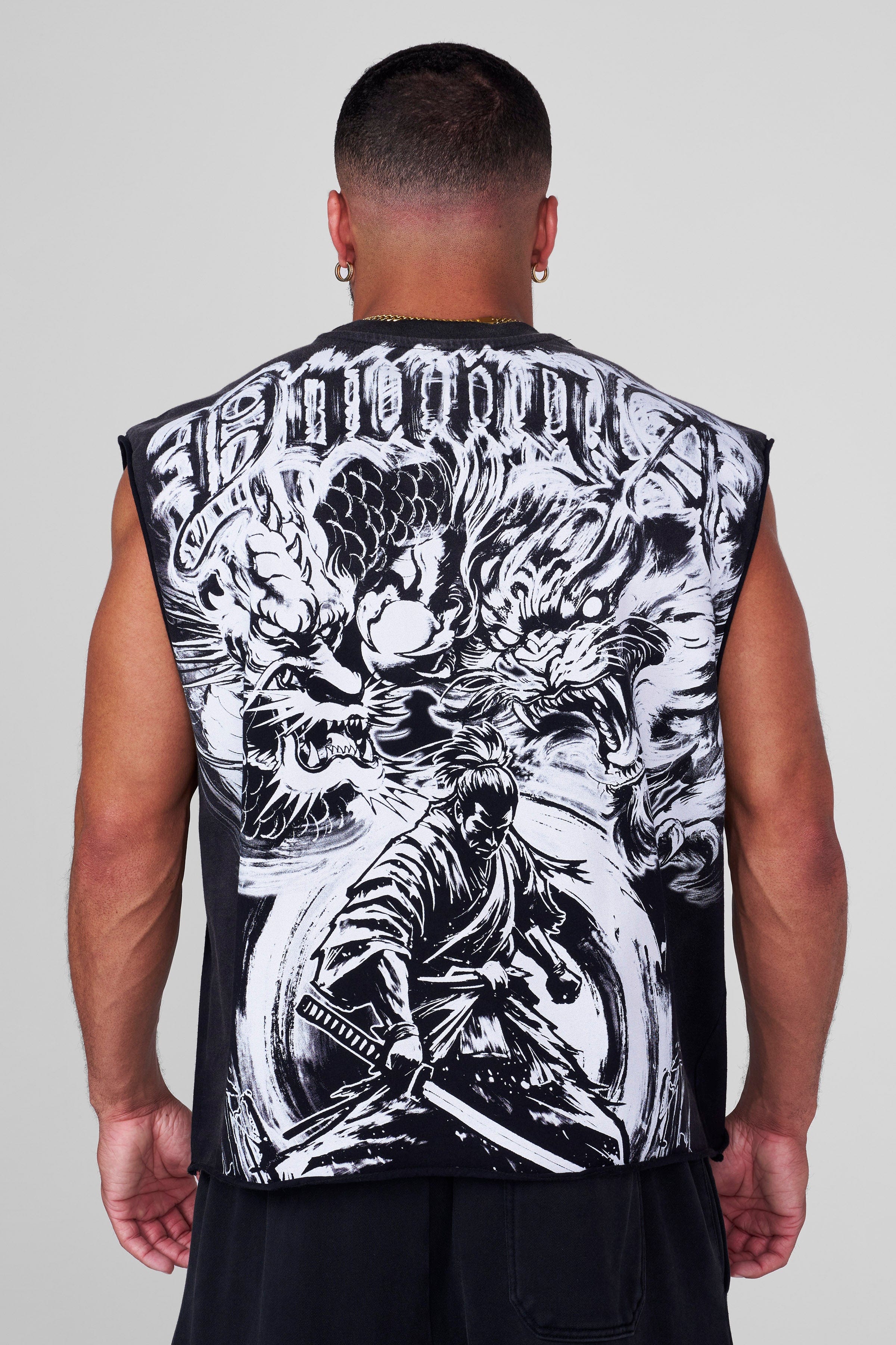 Side view of graphic shorts men styled with street sneakers