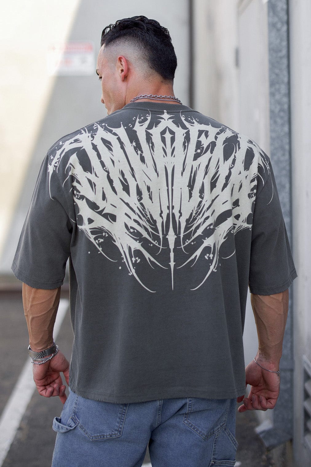 Front view of Chaos oversized graphic tee showcasing tattoo-inspired design.