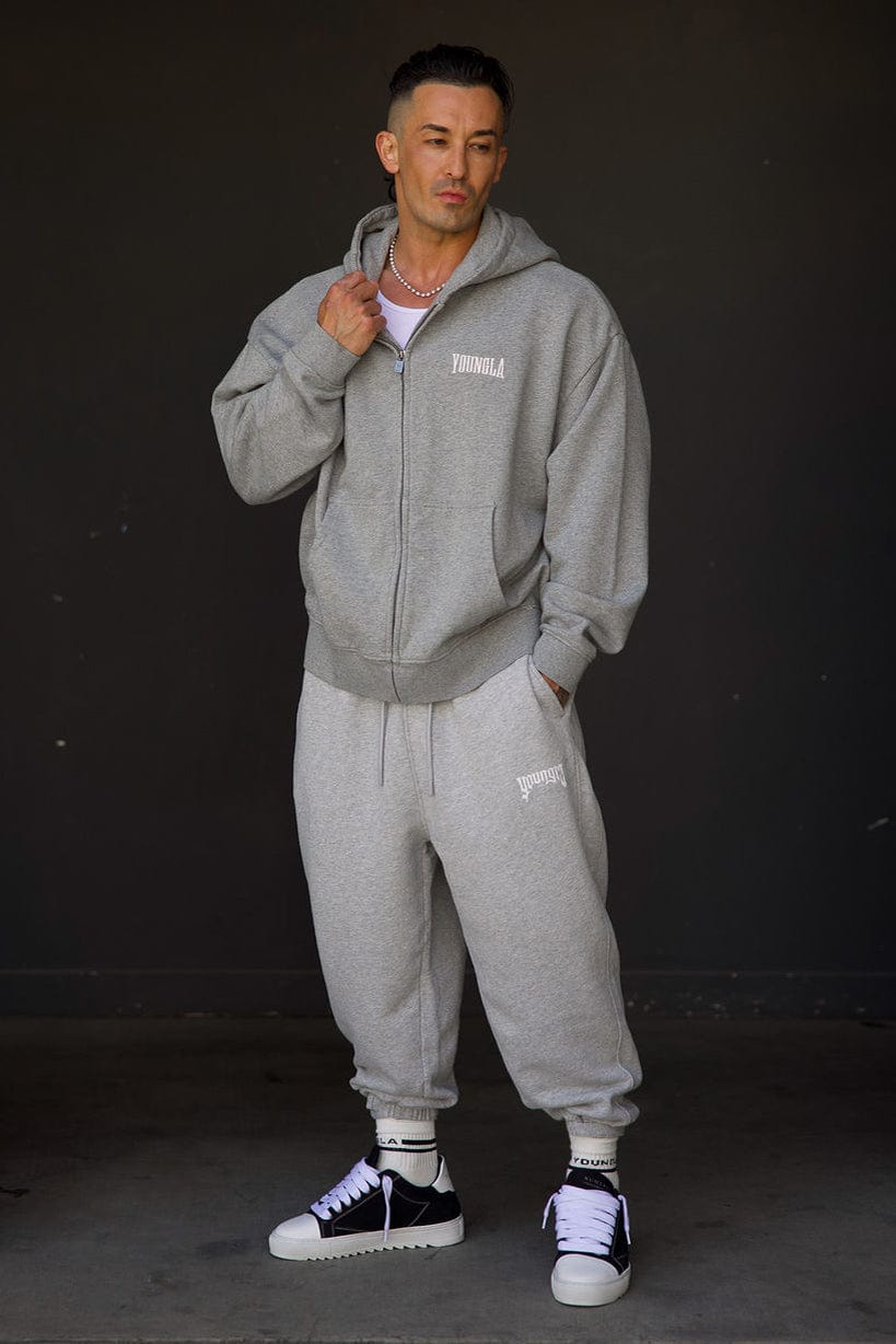 Side view of the black zip-up hoodie, perfect for casual outings.