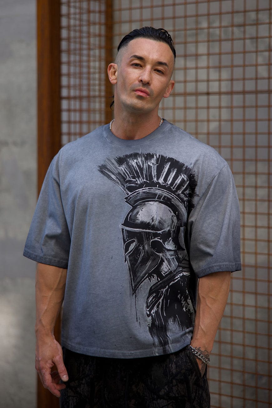 Side angle of the oversized Spartan tee highlighting the relaxed fit.
