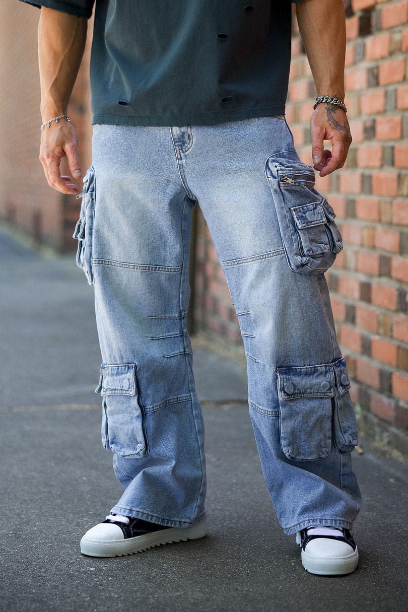Front view of urban utility stacked jeans for men with cargo pockets.