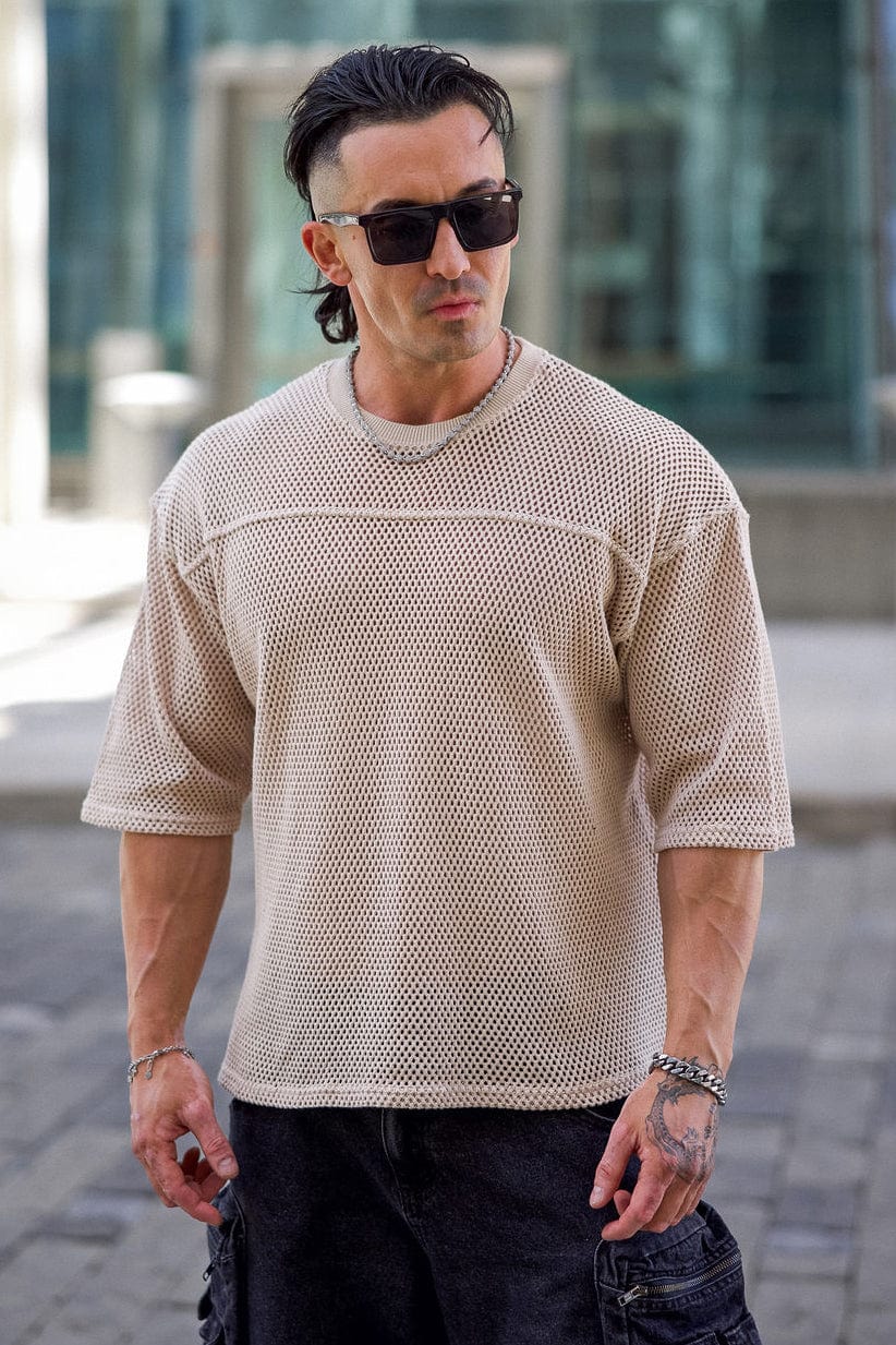 Close-up of the breathable knit fabric texture on a white cotton tee