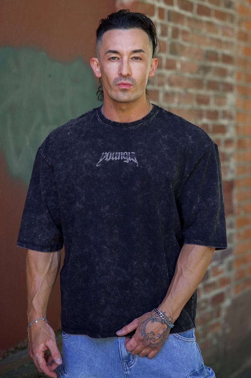 Close-up of vintage acid wash oversized t shirt fabric showing texture and design details