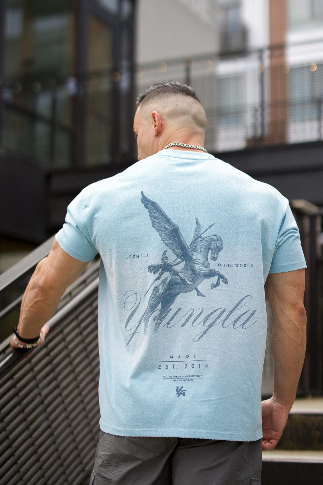 Model showcasing the Spartan tee, highlighting its comfortable fit.