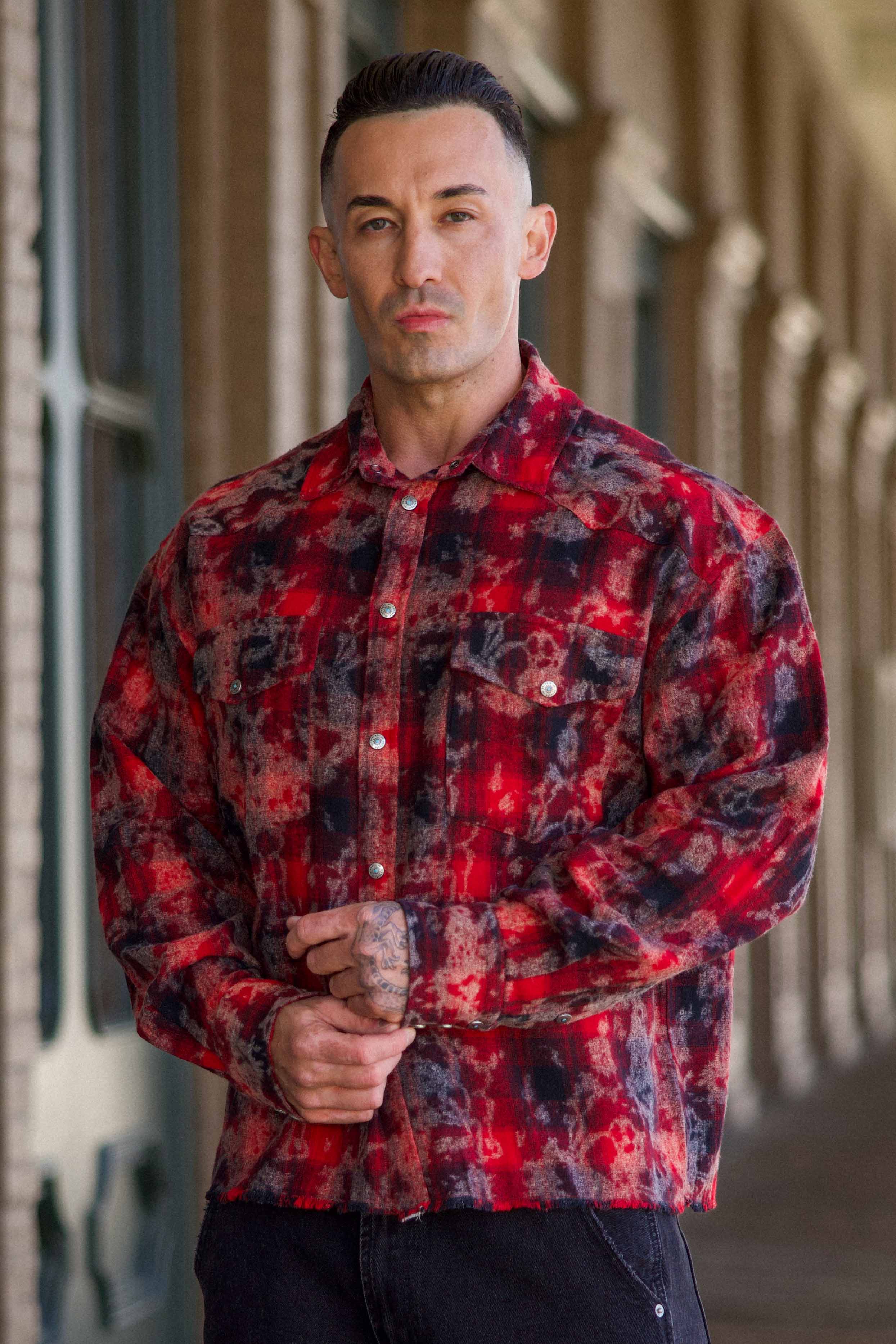 Model wearing the Urban Outlaw flannel shirt, styled for a casual outdoor look.